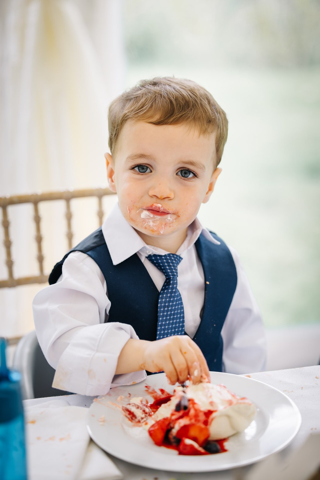 The page boy tucking into a messy dessert at the table