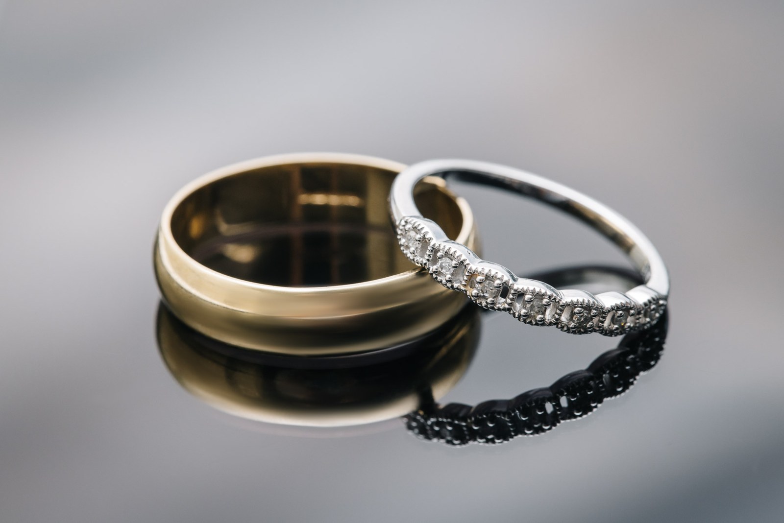Close-up of the gold wedding band and diamond engagement ring