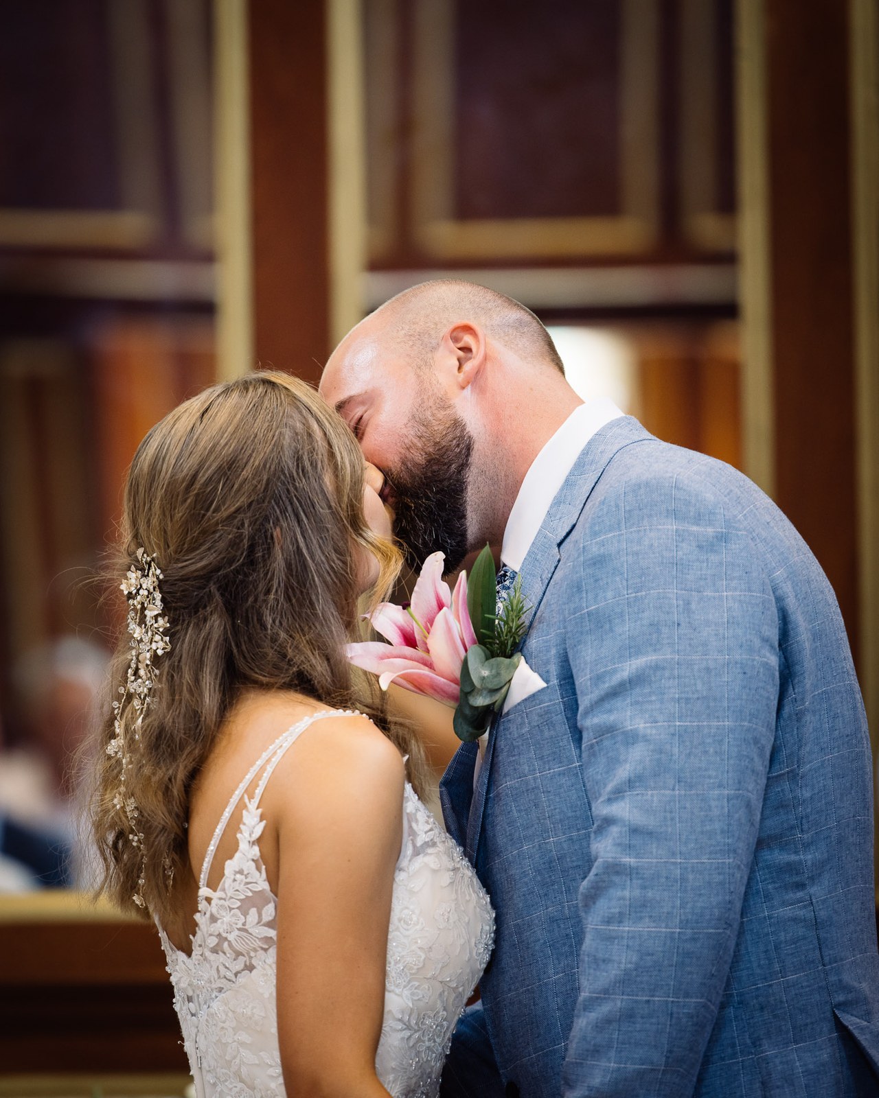 The couple sharing their first kiss as newlyweds