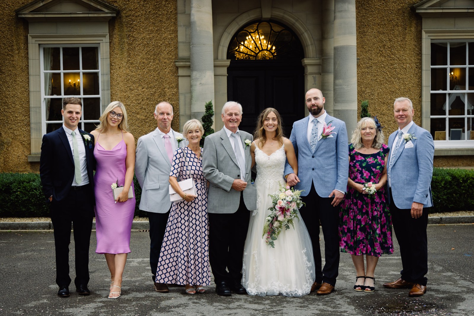A family group portrait outside the entrance to Bourton Hall