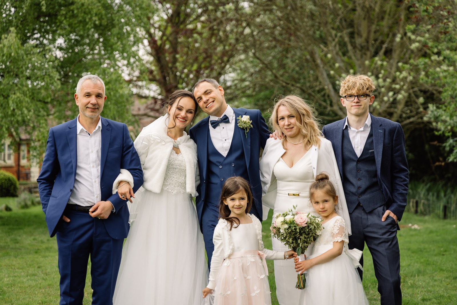 A family group portrait on the lawn at Cantley House Hotel with the children