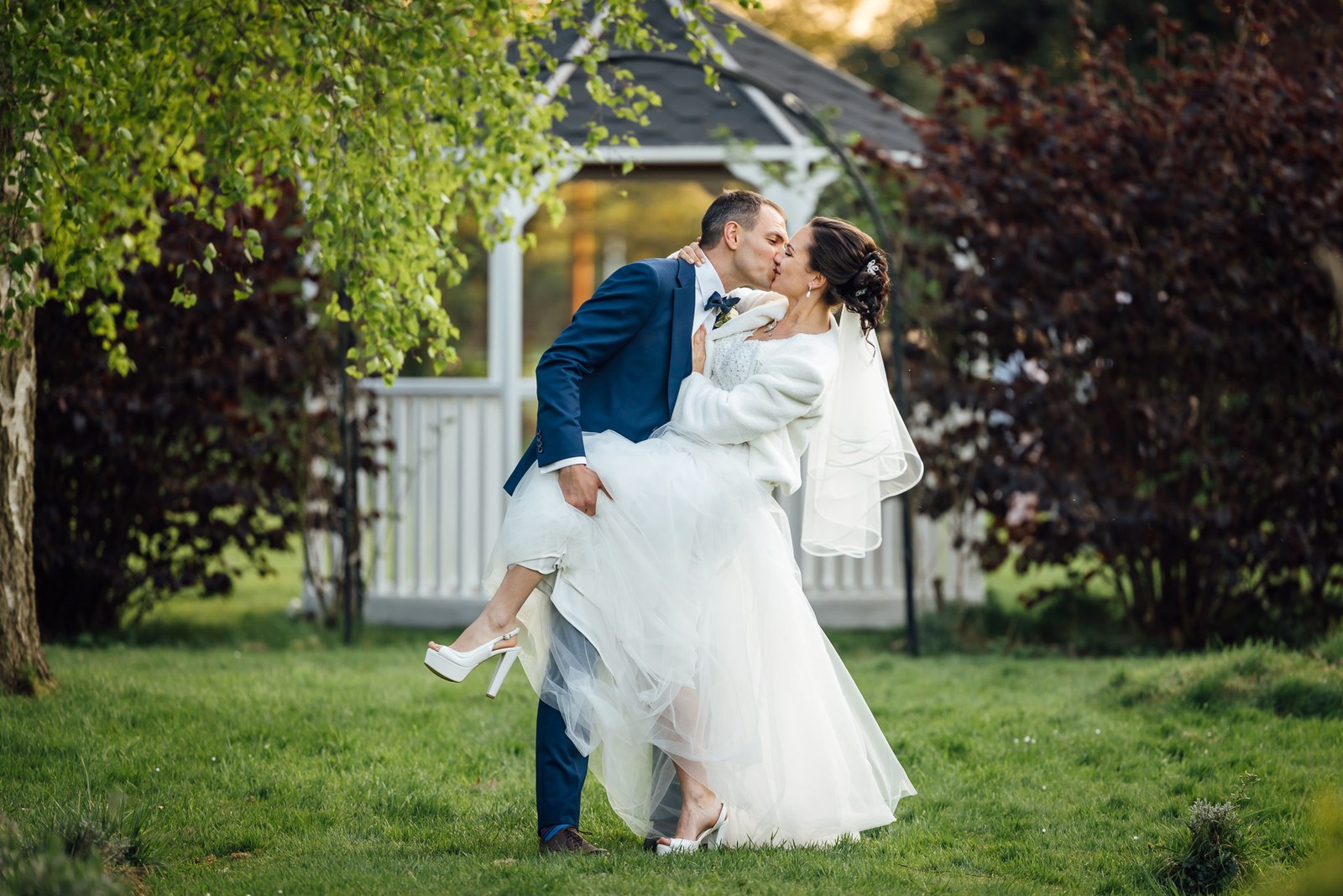 The groom dipping the bride for a kiss on the Cantley House Hotel lawn