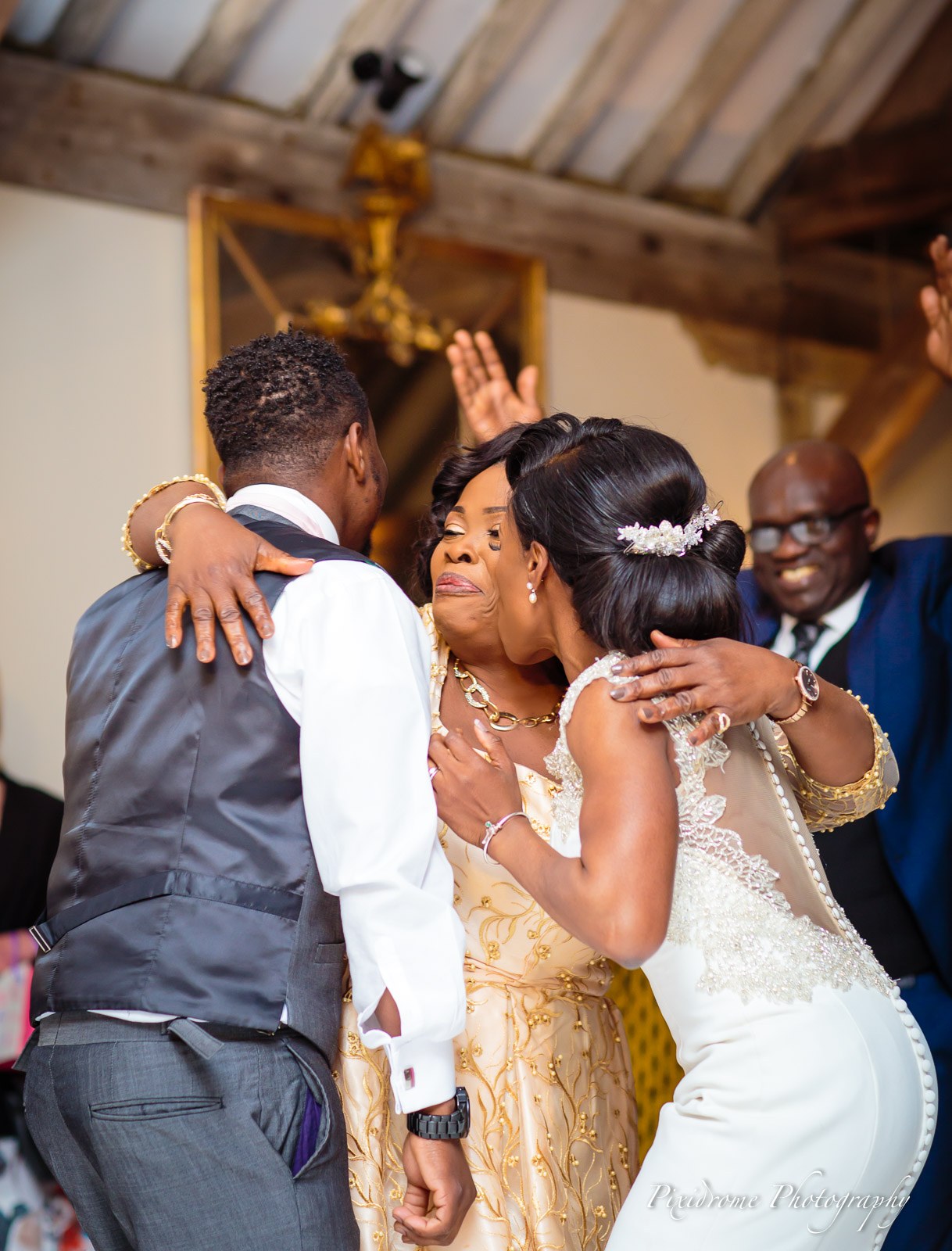 The bride dancing and embracing family on the dancefloor