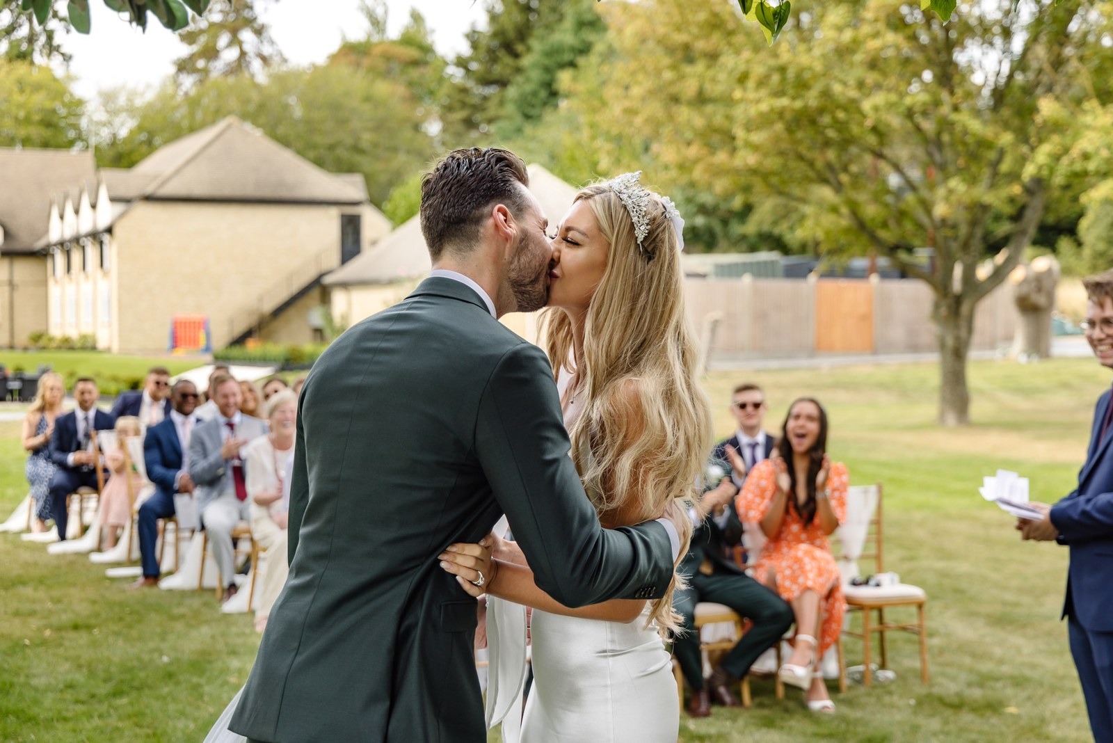 The couple's first kiss at the outdoor ceremony