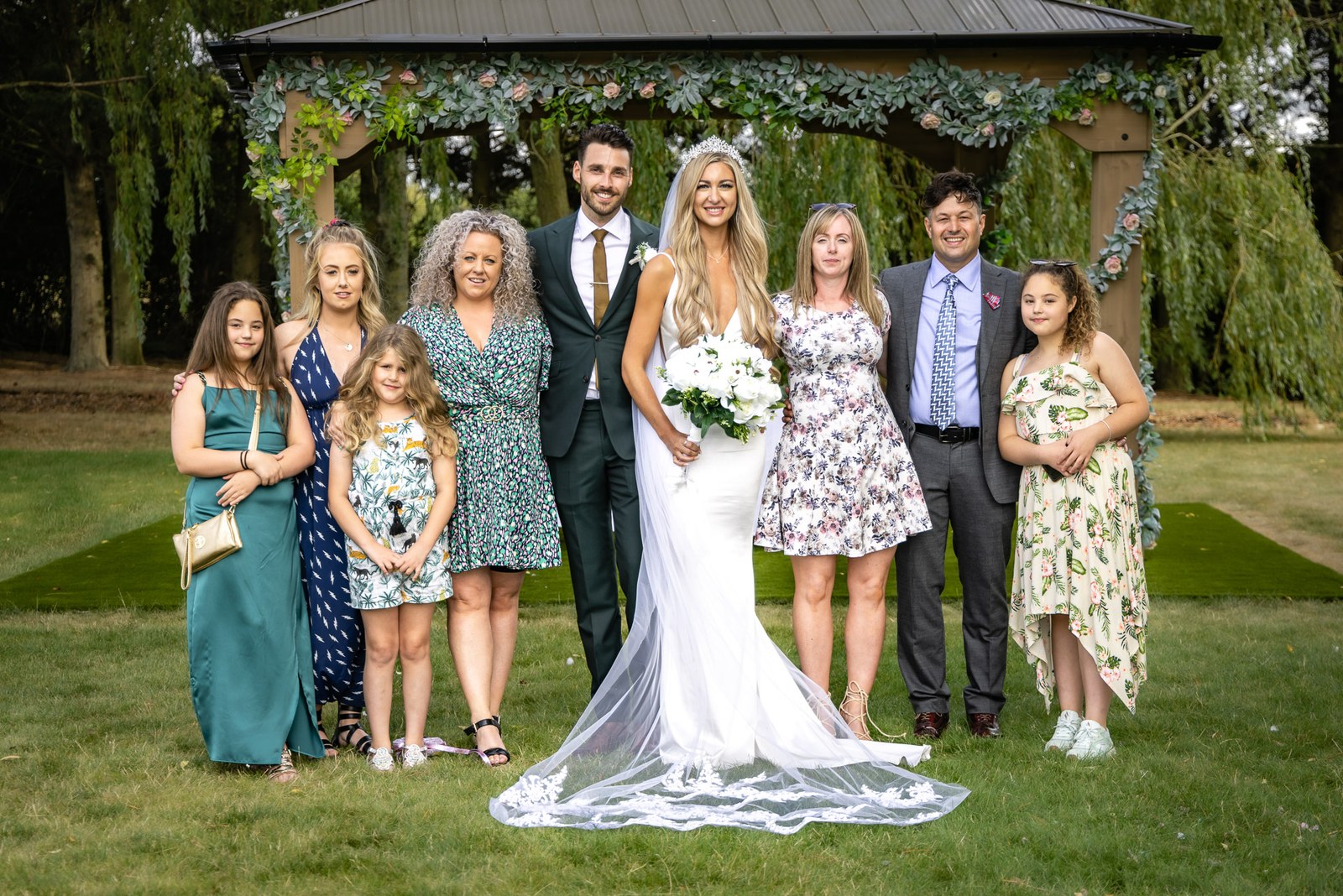 A family group portrait before the flower-decked gazebo at the Chesterton Hotel