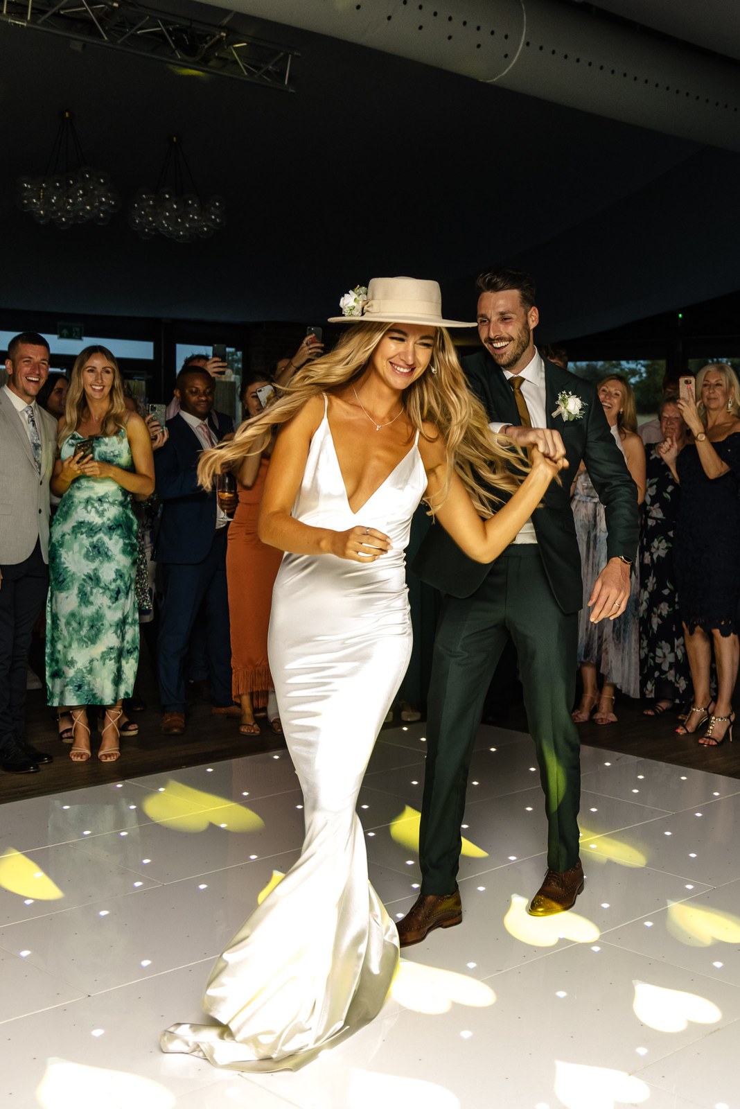 The first dance on the starlit floor at the Chesterton Hotel as guests gather round