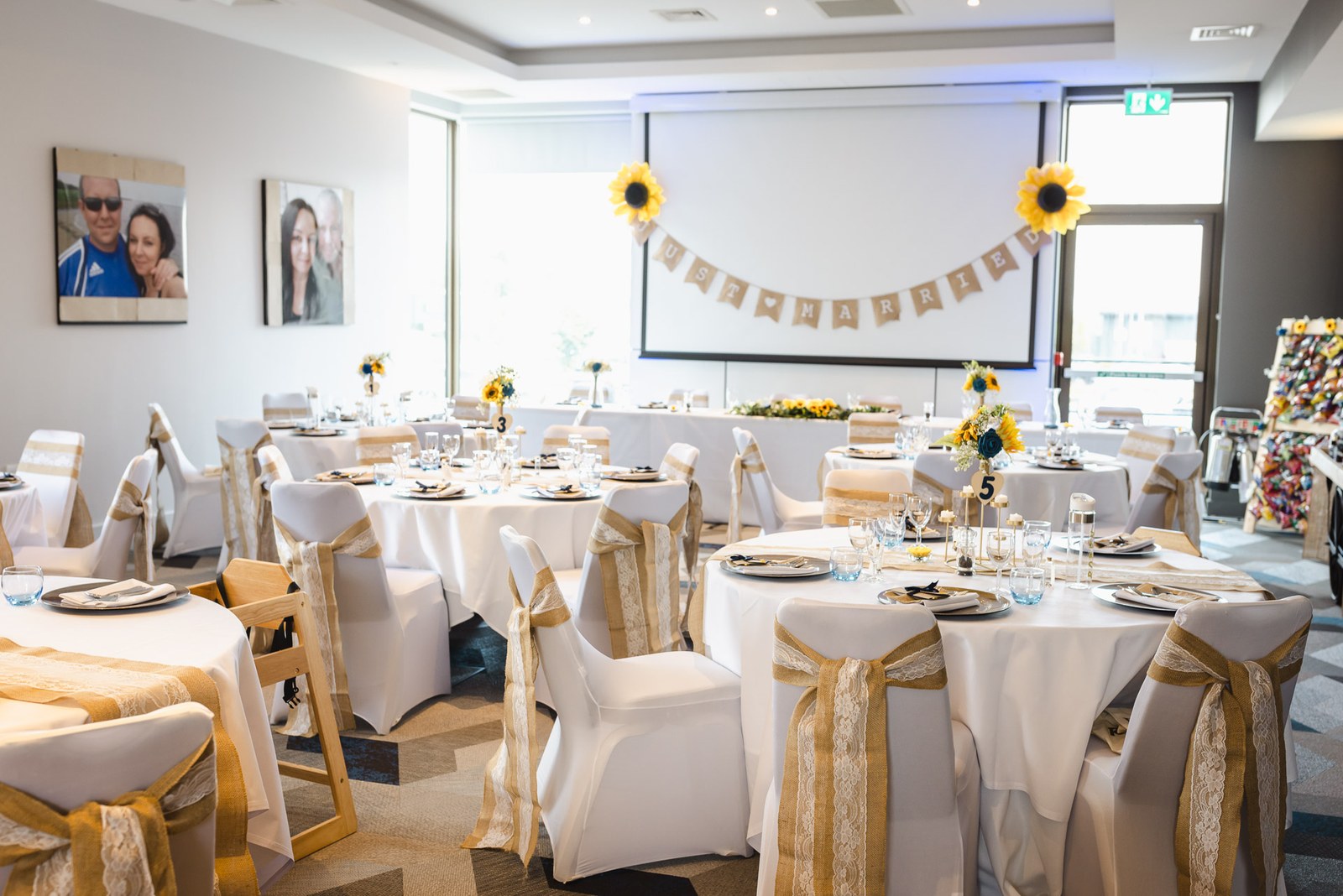 The reception room at Courtyard by Marriott Oxford South dressed with sunflower centrepieces and hessian sashes