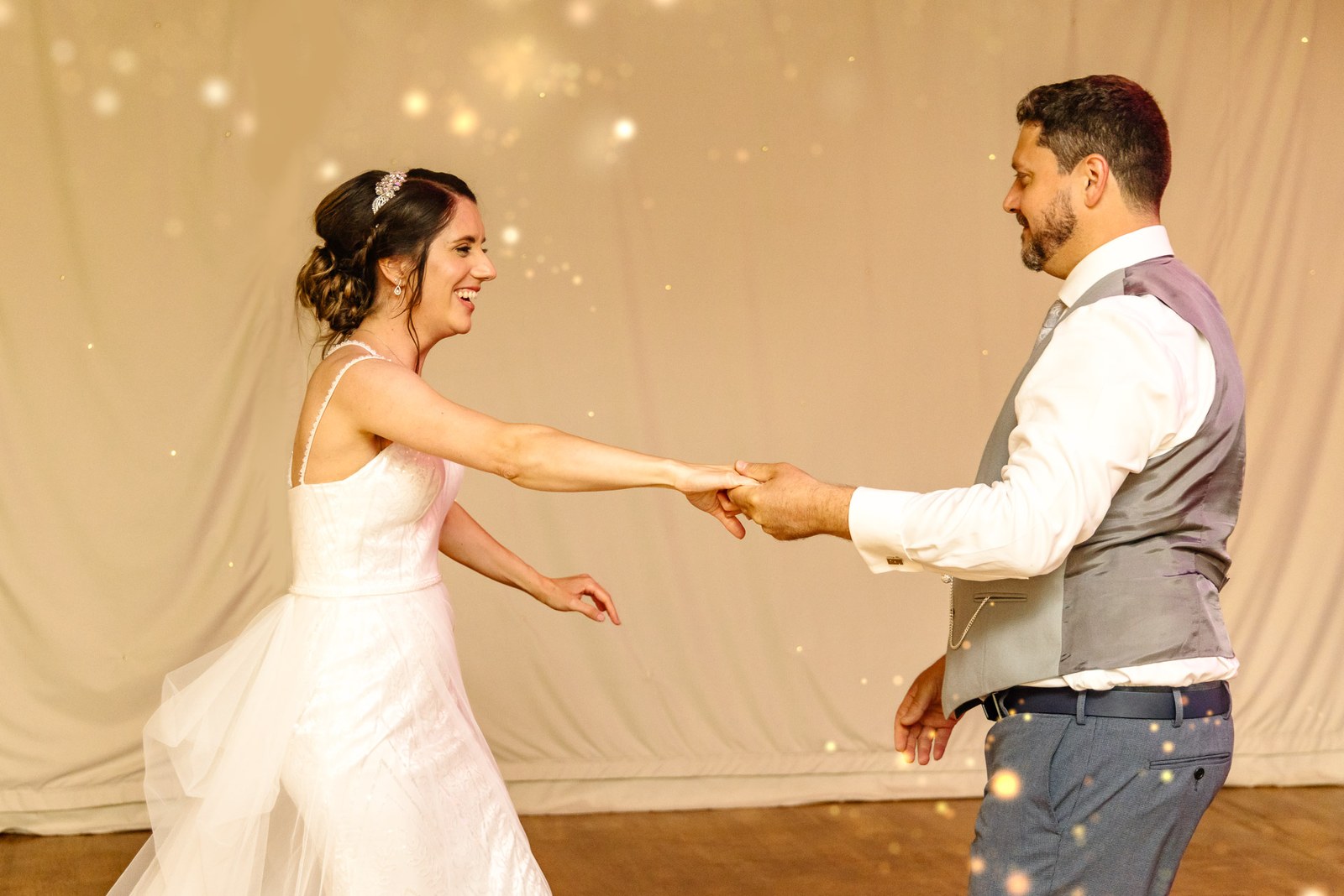 The couple dance amid a shower of sparkle effects in the marquee