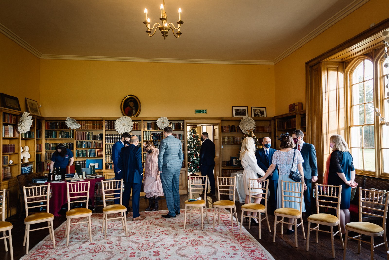 The book-lined library at Delapre Abbey set with chairs for the ceremony