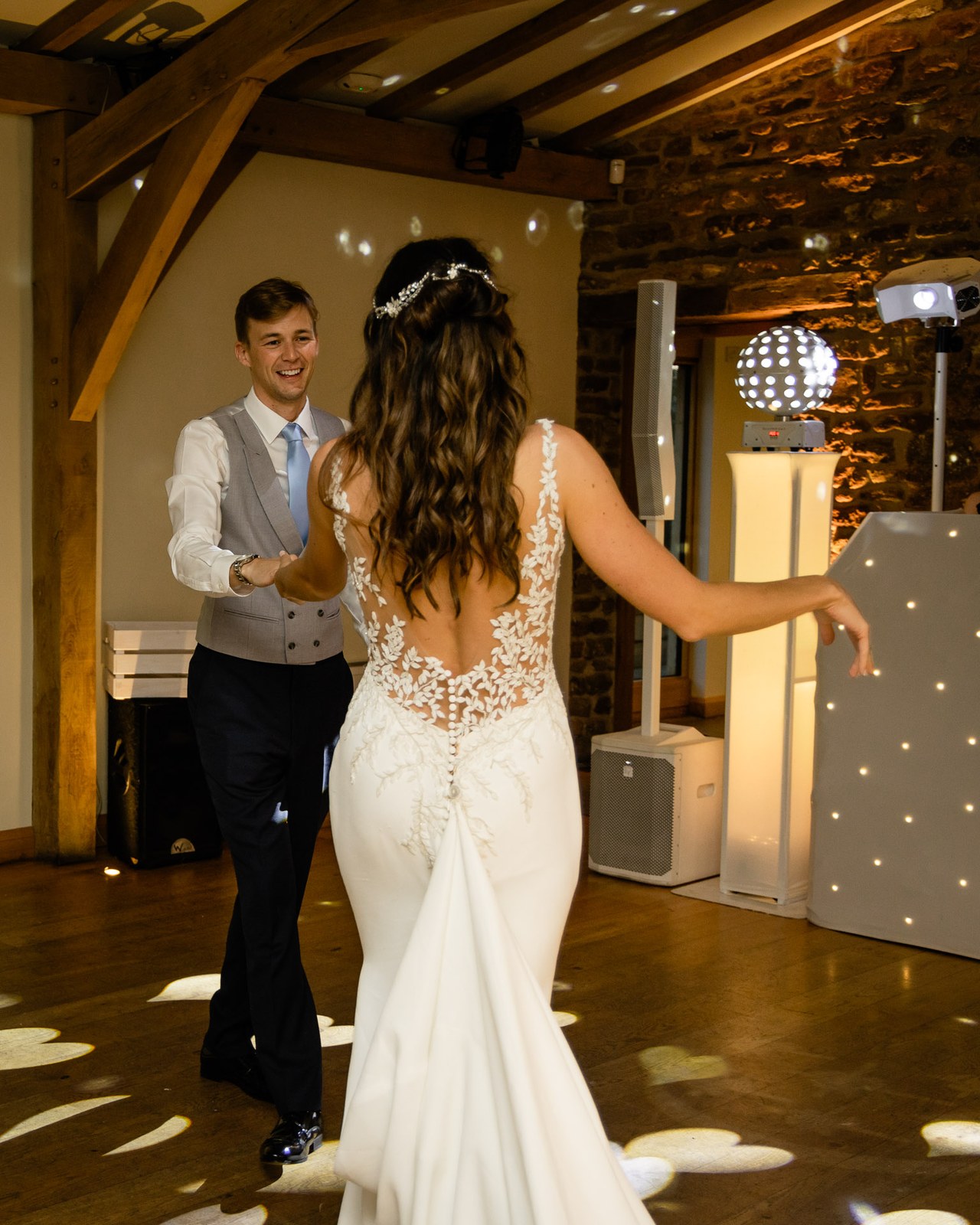 First dance on the wooden floor of Dodford Manor's reception room, a starlit backdrop behind