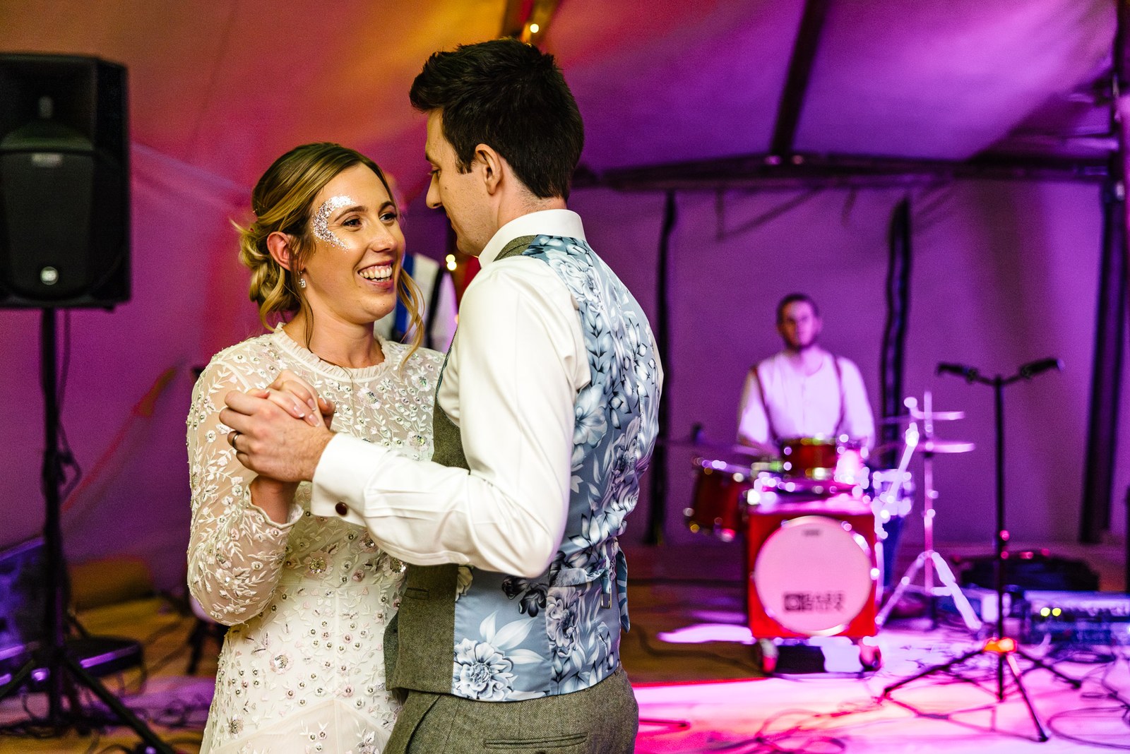 The couple's first dance before the live band in the tipi at Dovecote Events
