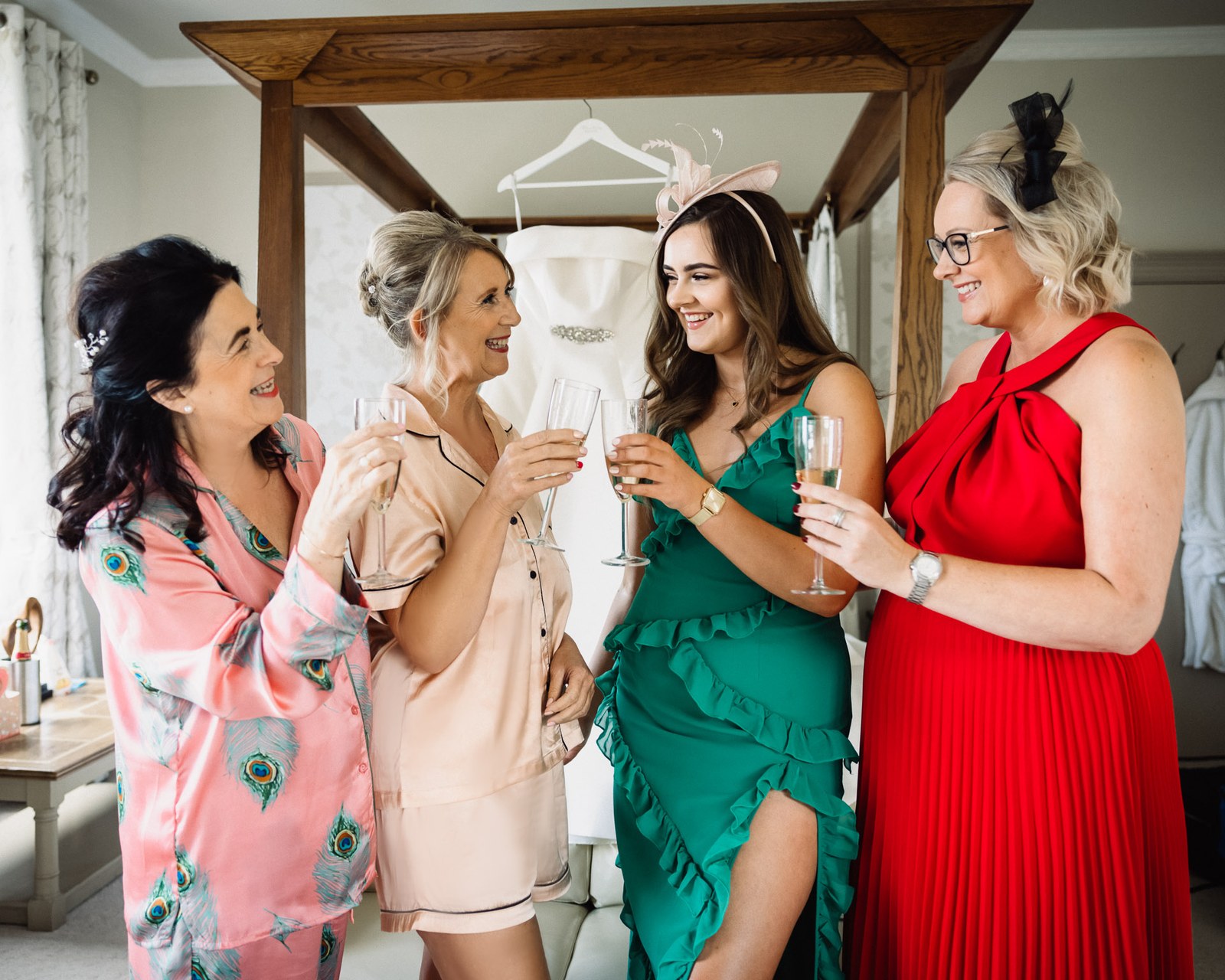 The bride and her guests raising a champagne toast during the morning preparations