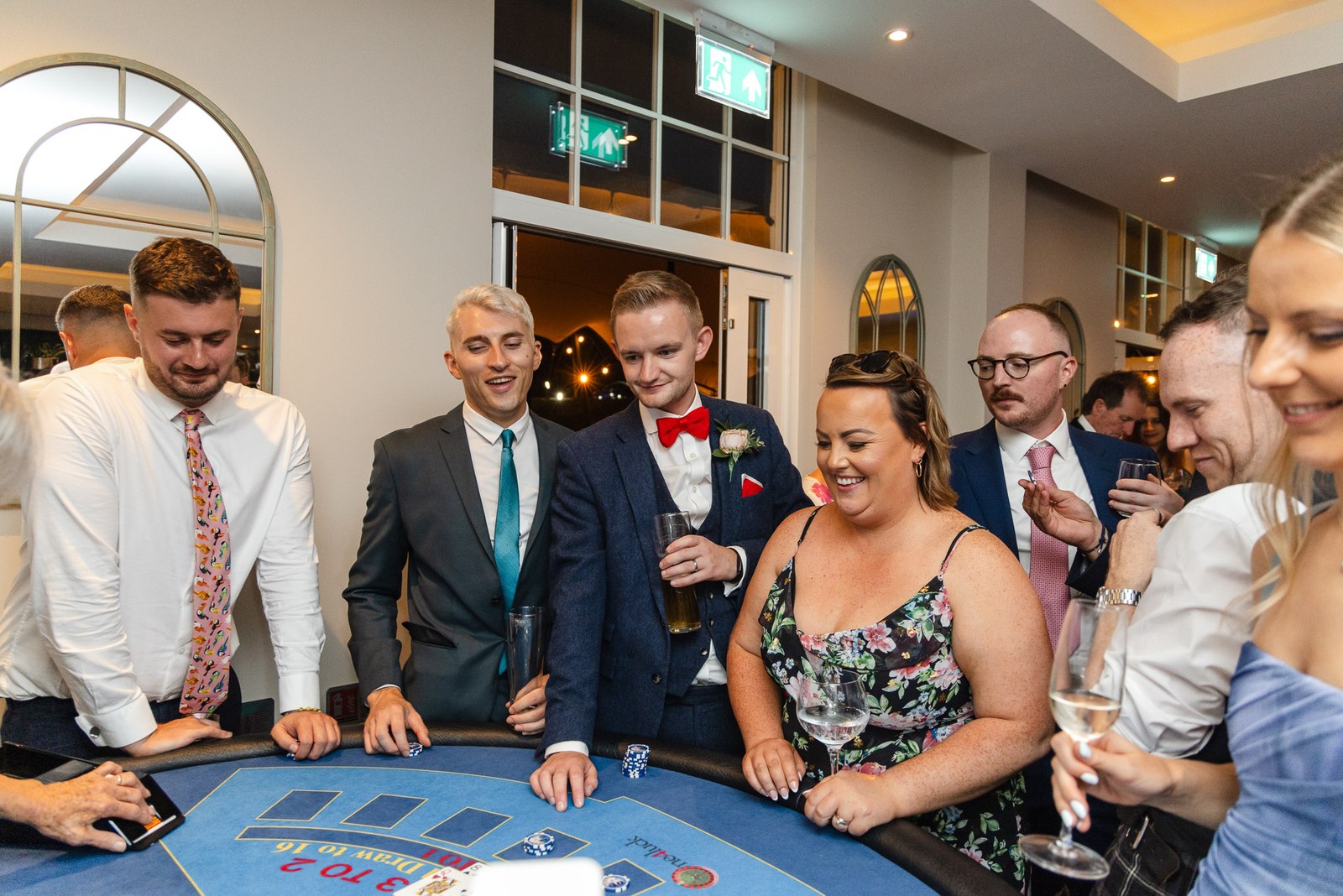 Guests trying their luck at a casino table during the reception
