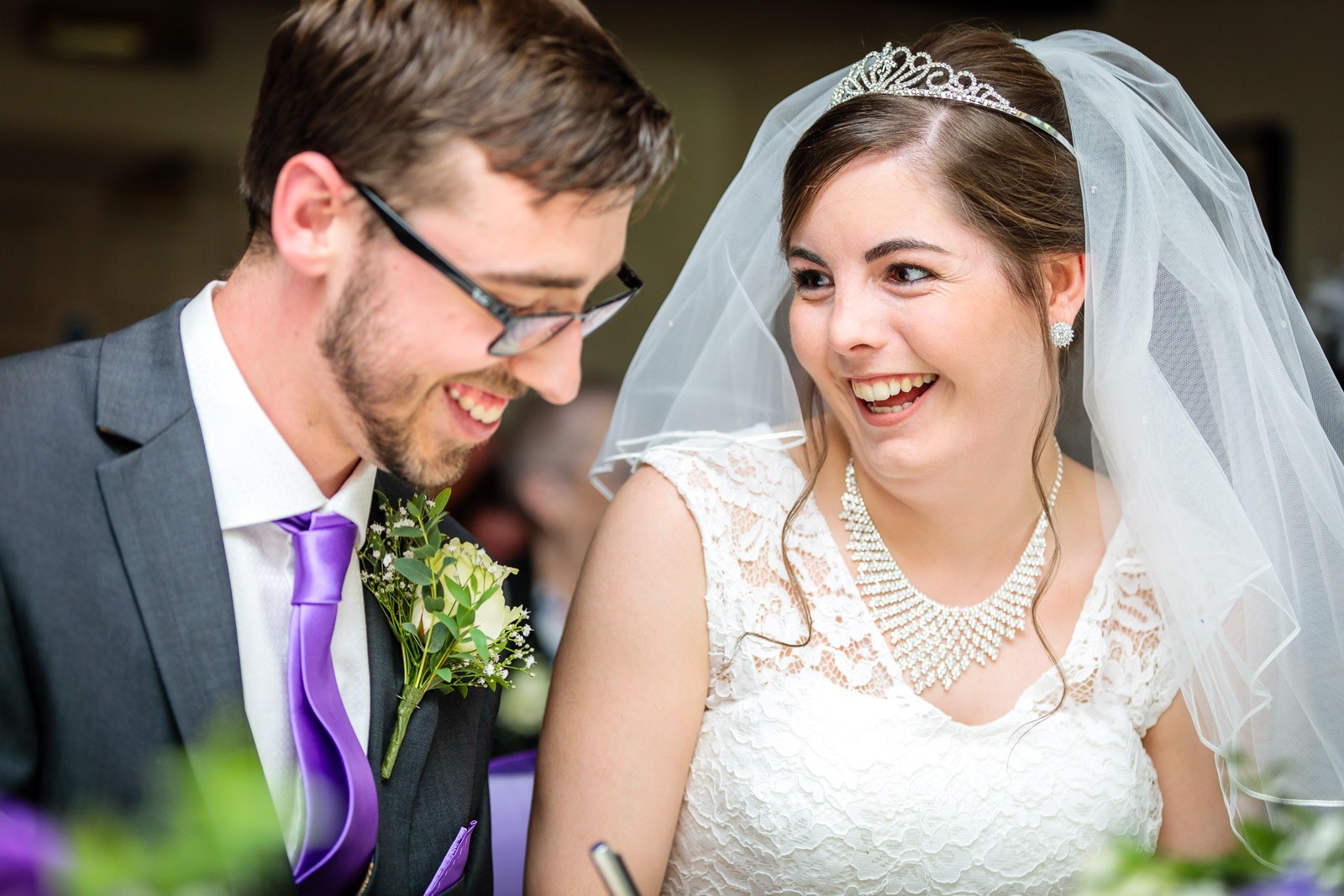 The newlyweds laughing together as the ceremony ends