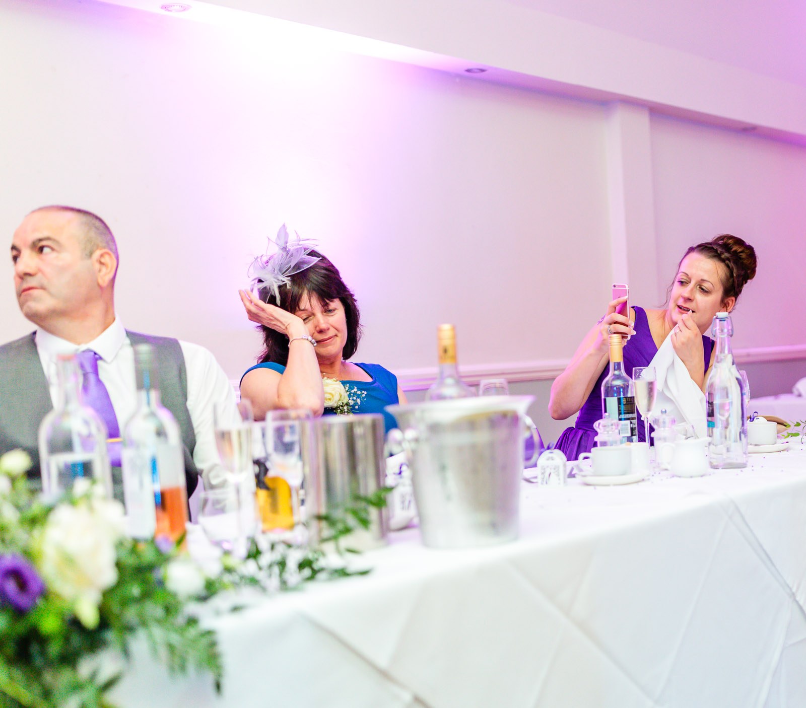 Guests at the top table, one dabbing away a tear during the speeches
