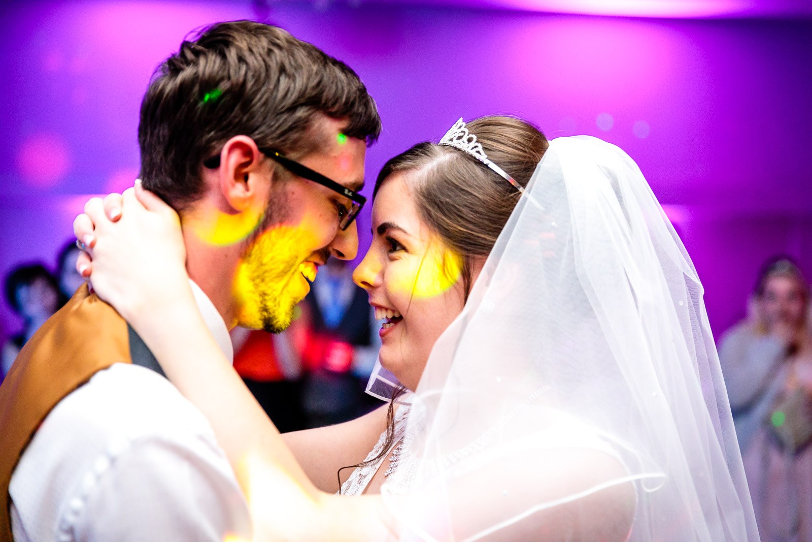 Bride and groom forehead to forehead during their first dance