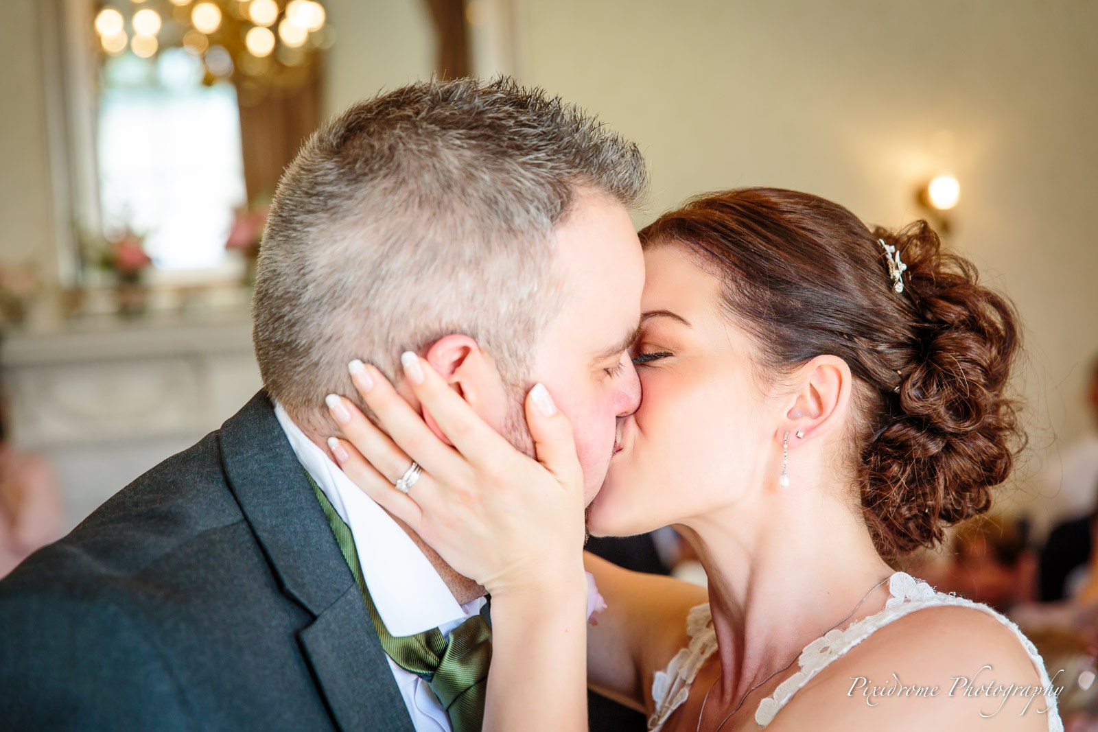 The newlyweds sharing a tender kiss at the ceremony
