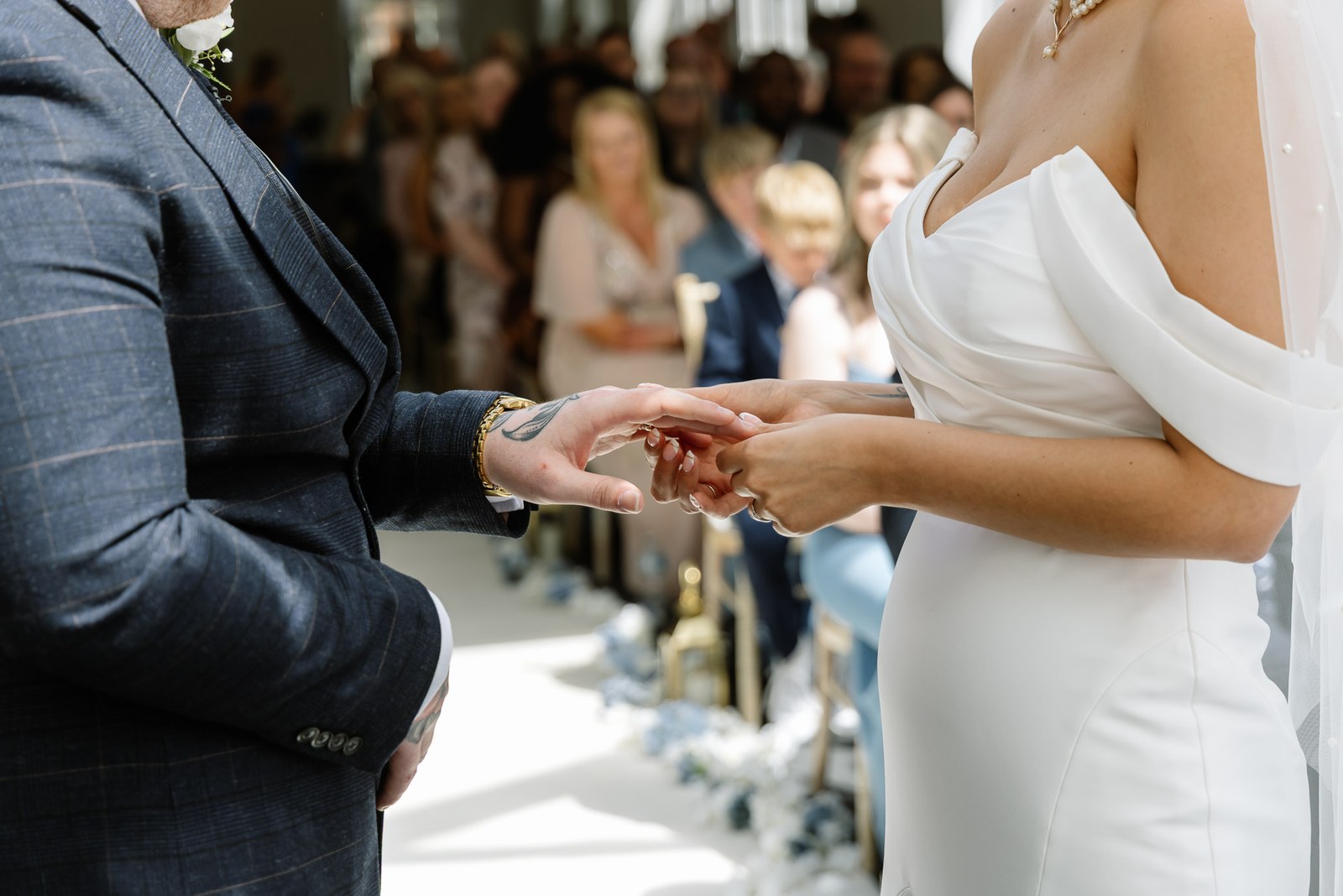 Close-up of the ring being exchanged during the ceremony