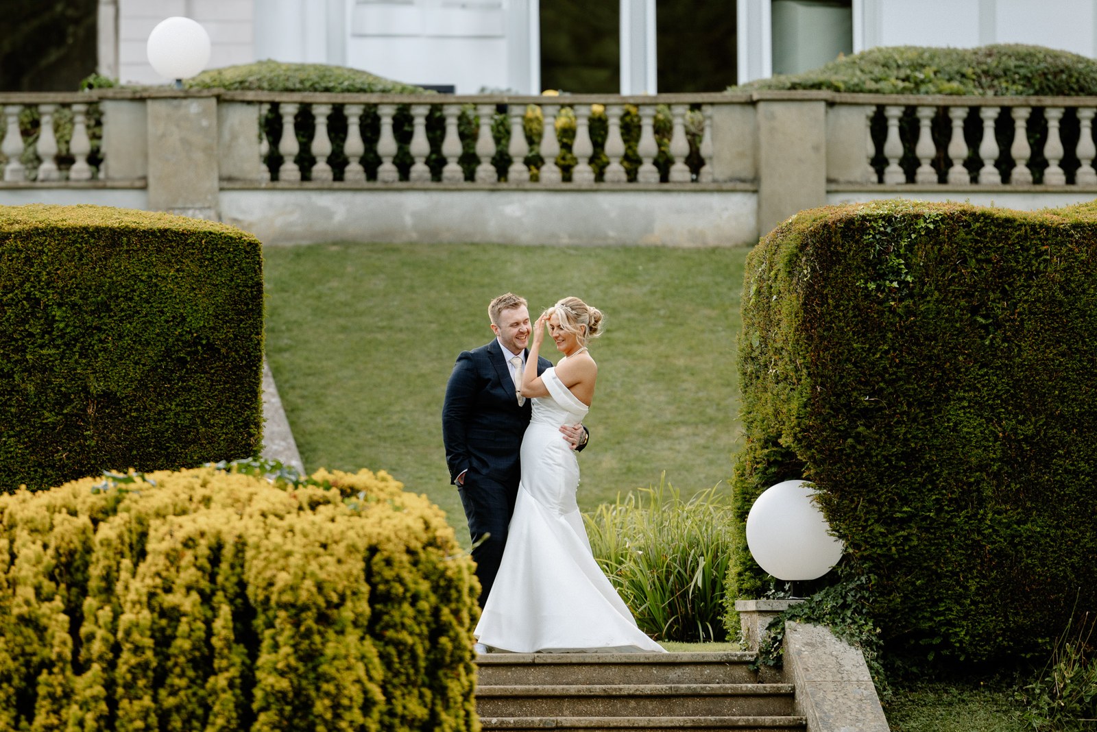 The couple in the formal garden below the balustraded terrace at Hunton Park Hotel