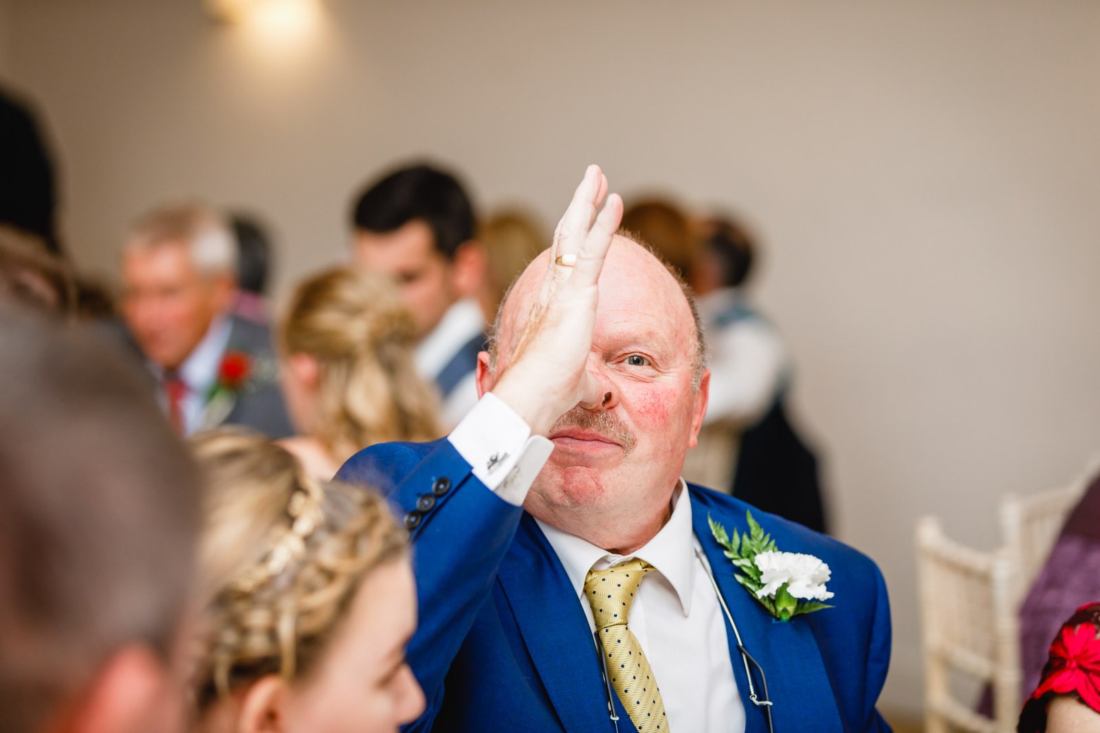 A guest tossing something at a friend during a lively party game