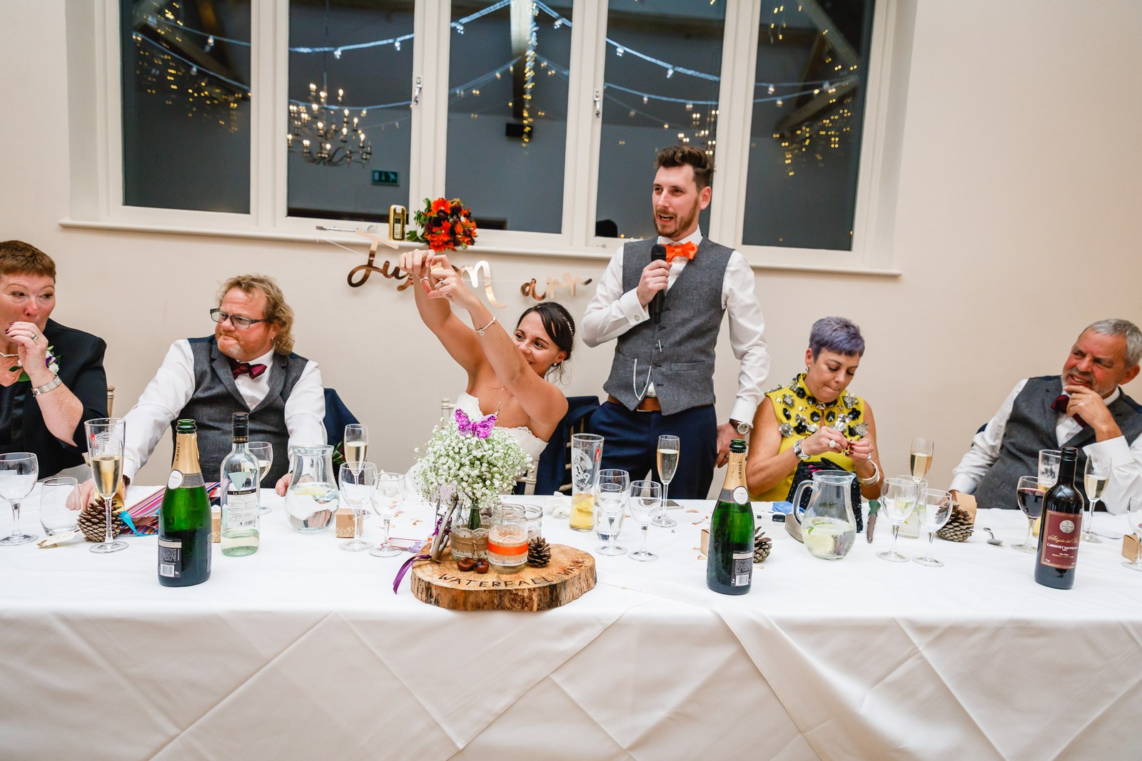 The top table during the speeches, the groom on the microphone