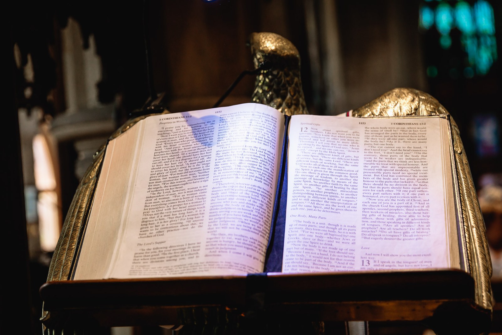 An open Bible resting on the church's brass eagle lectern