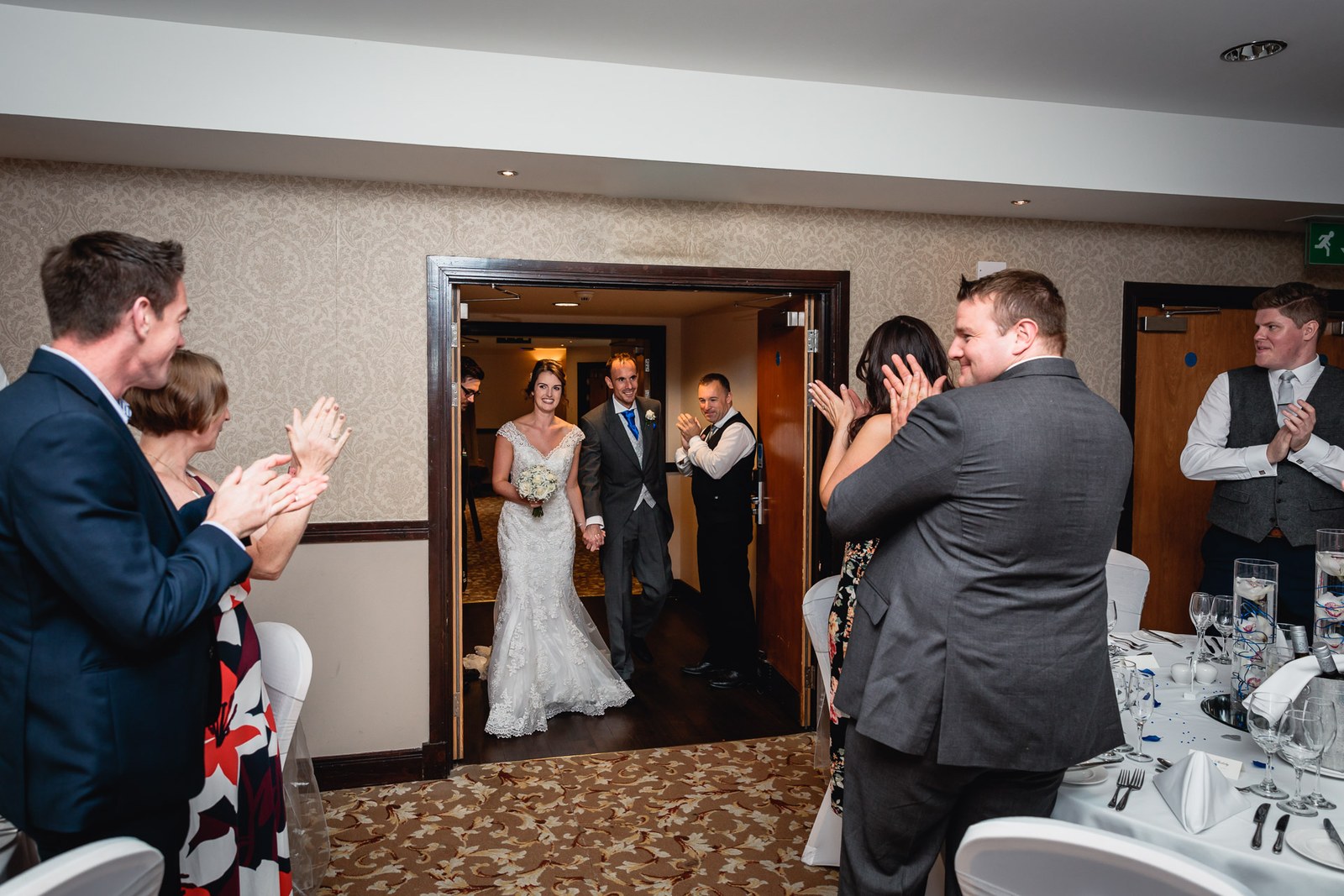 The couple applauded by guests as they enter the reception