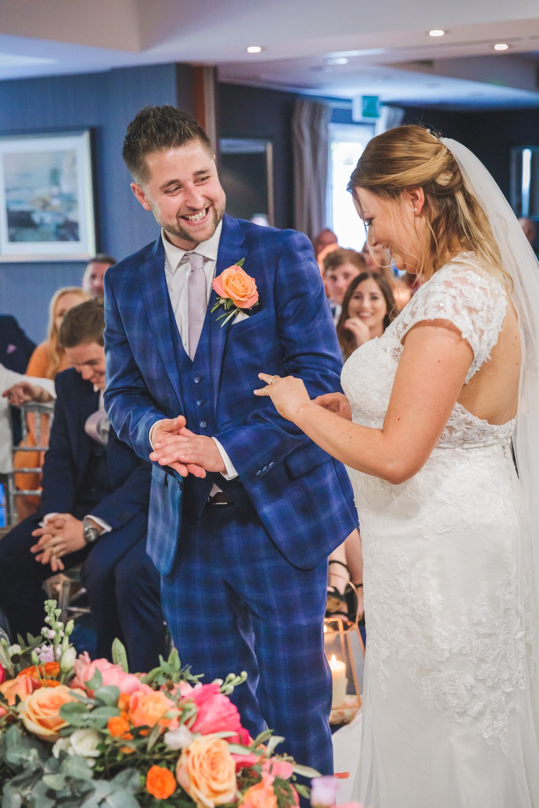 Bride and groom laughing together during the ceremony