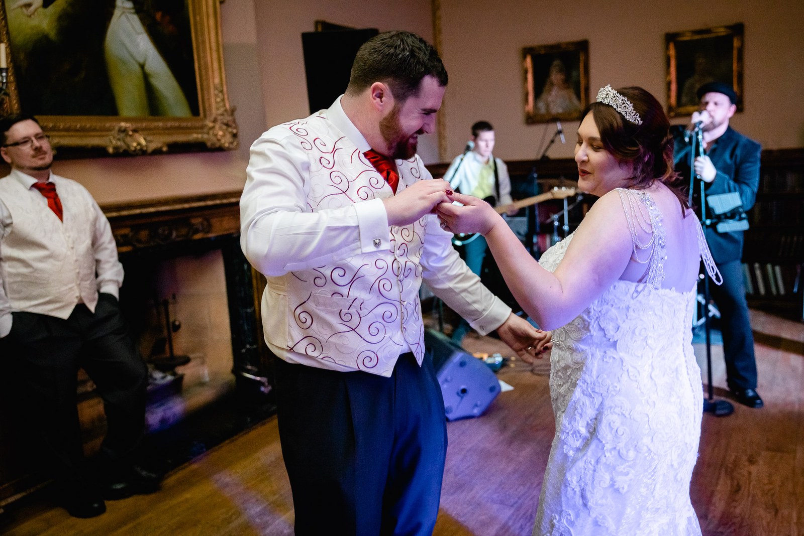 The newlyweds sharing their first dance with the band playing behind