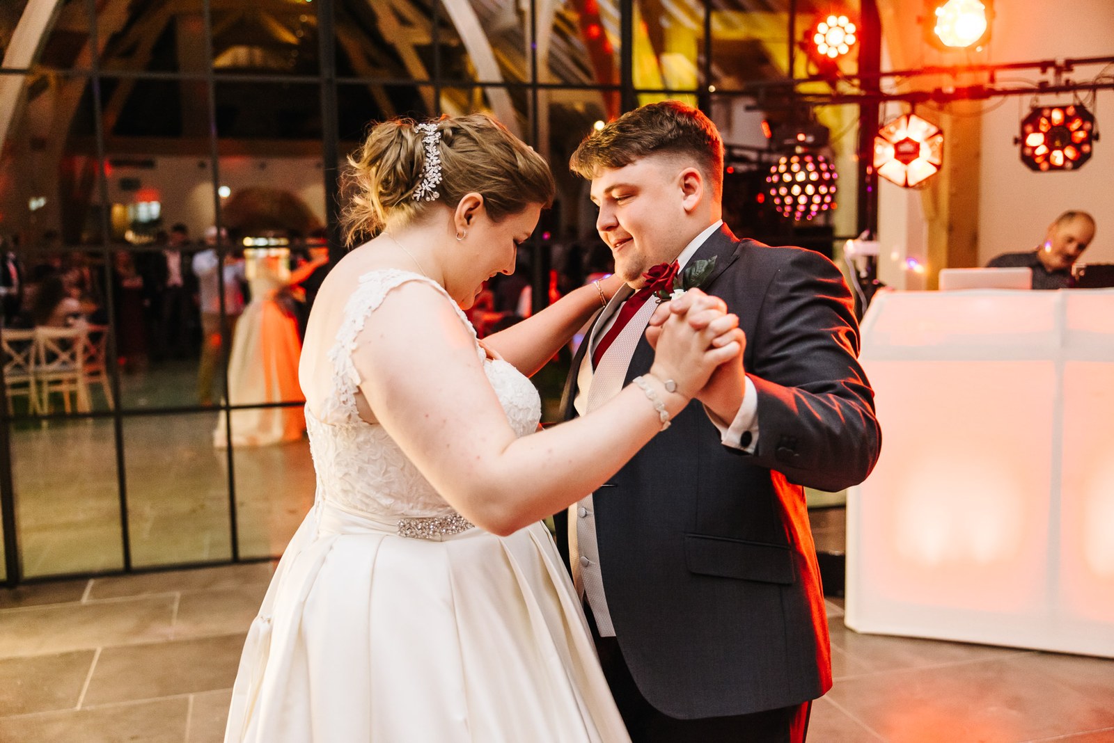 The couple's first dance beside the glowing light-up DJ booth