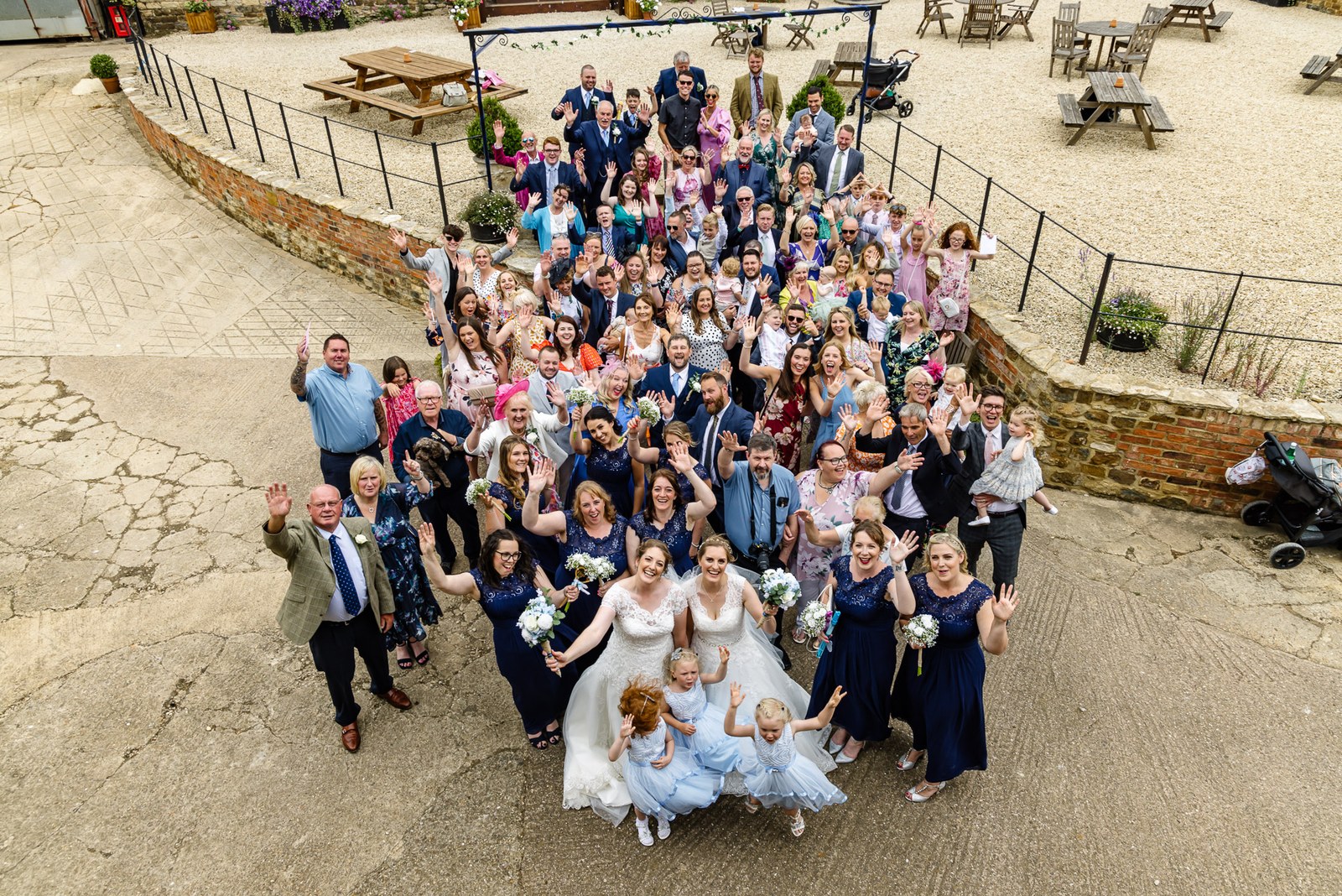 Aerial group photograph of all the guests on the courtyard at Slapton Manor