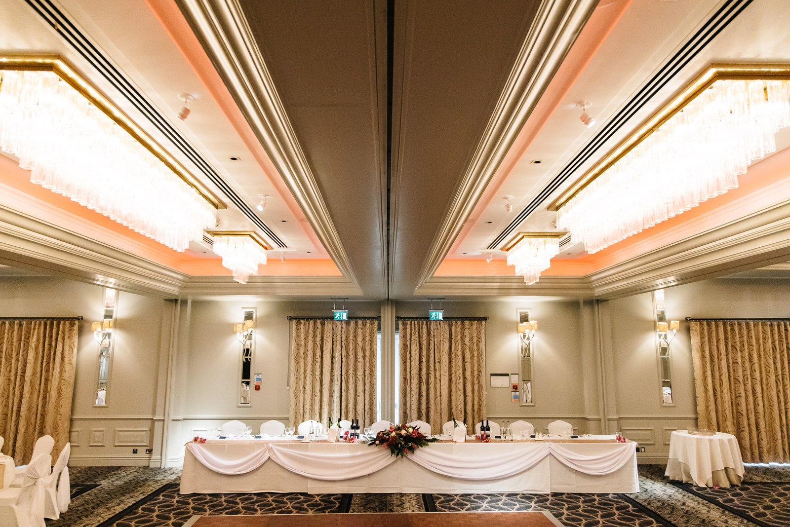 The Sopwell House ballroom dressed for the reception with a draped top table