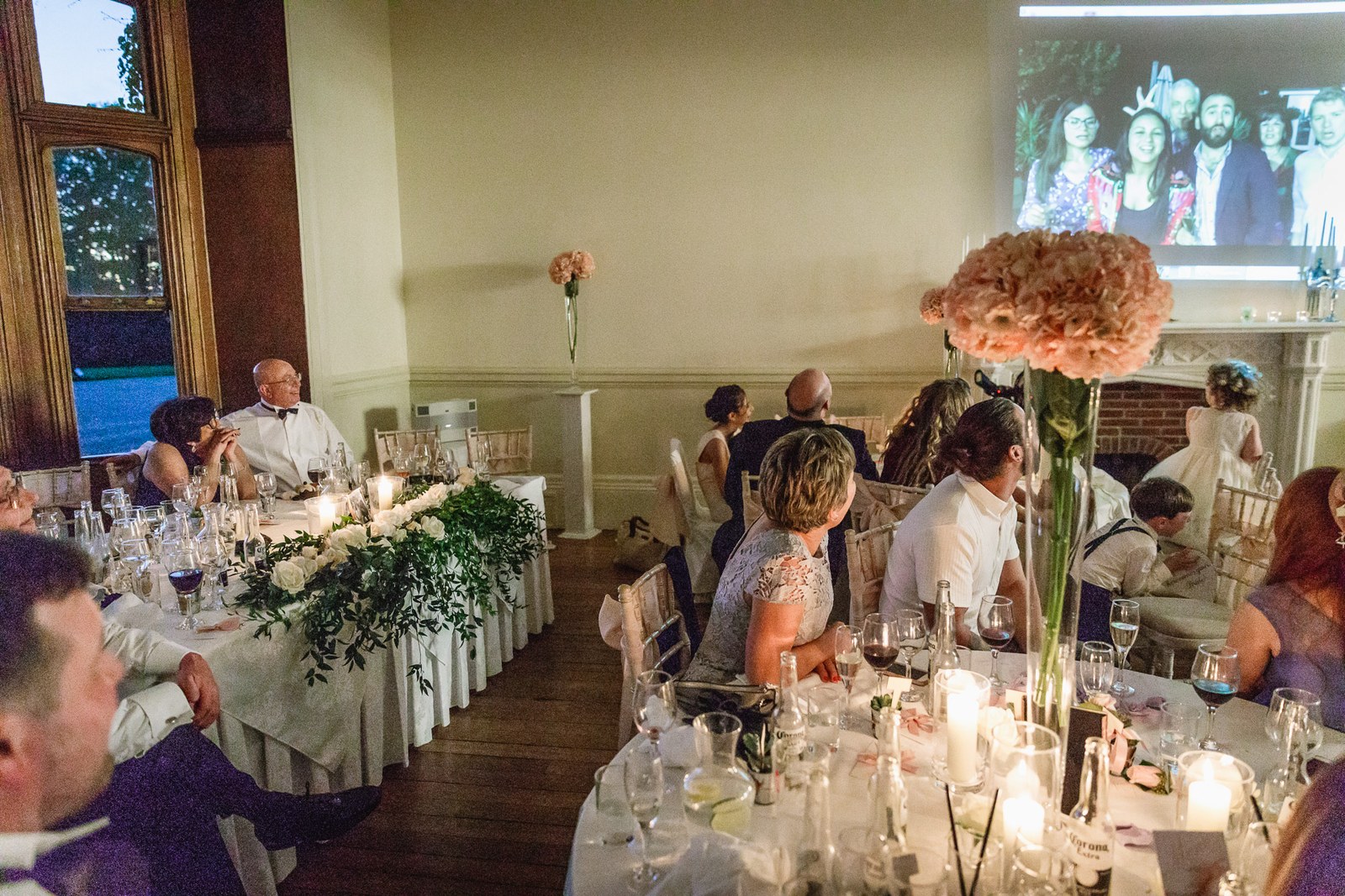 The St Audries Park reception room with the top table and a projector screen