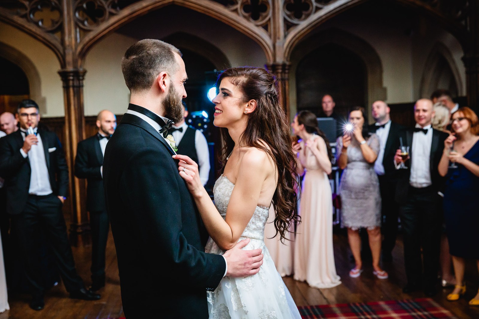 The couple dance beneath the stone Gothic arches of St Audries Park