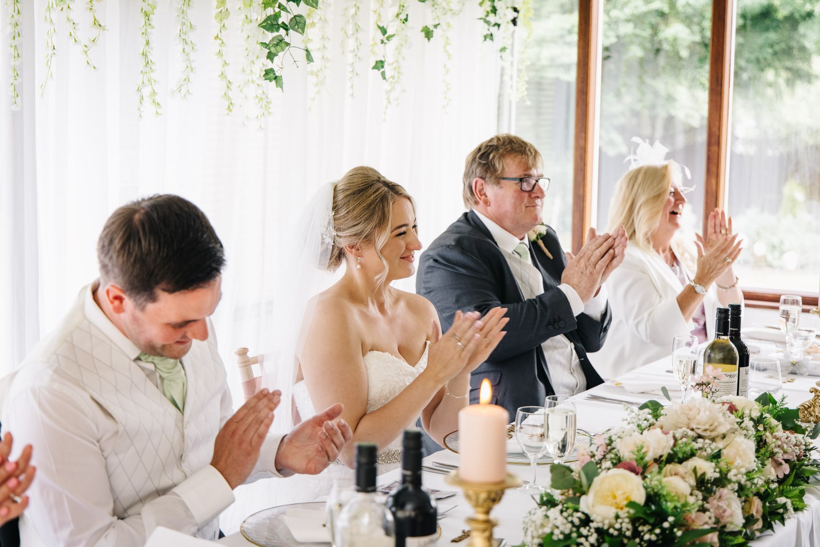 The top table applauding and laughing during the speeches