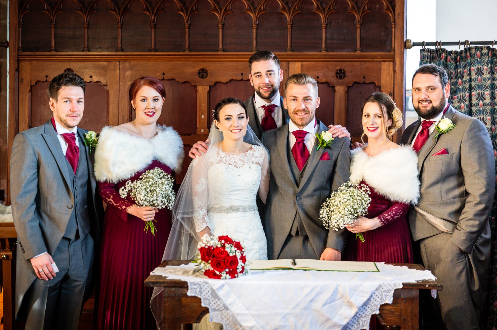 The wedding party gather behind the register-signing table