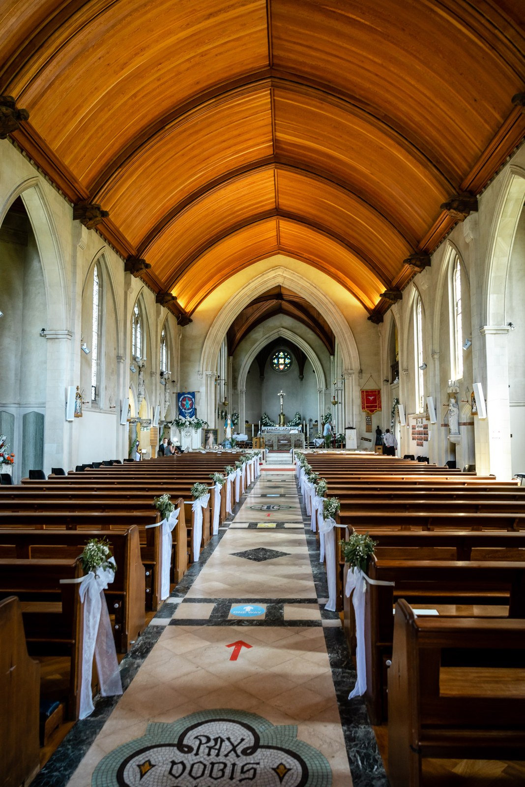 The timber-vaulted nave and long aisle of the church before the ceremony
