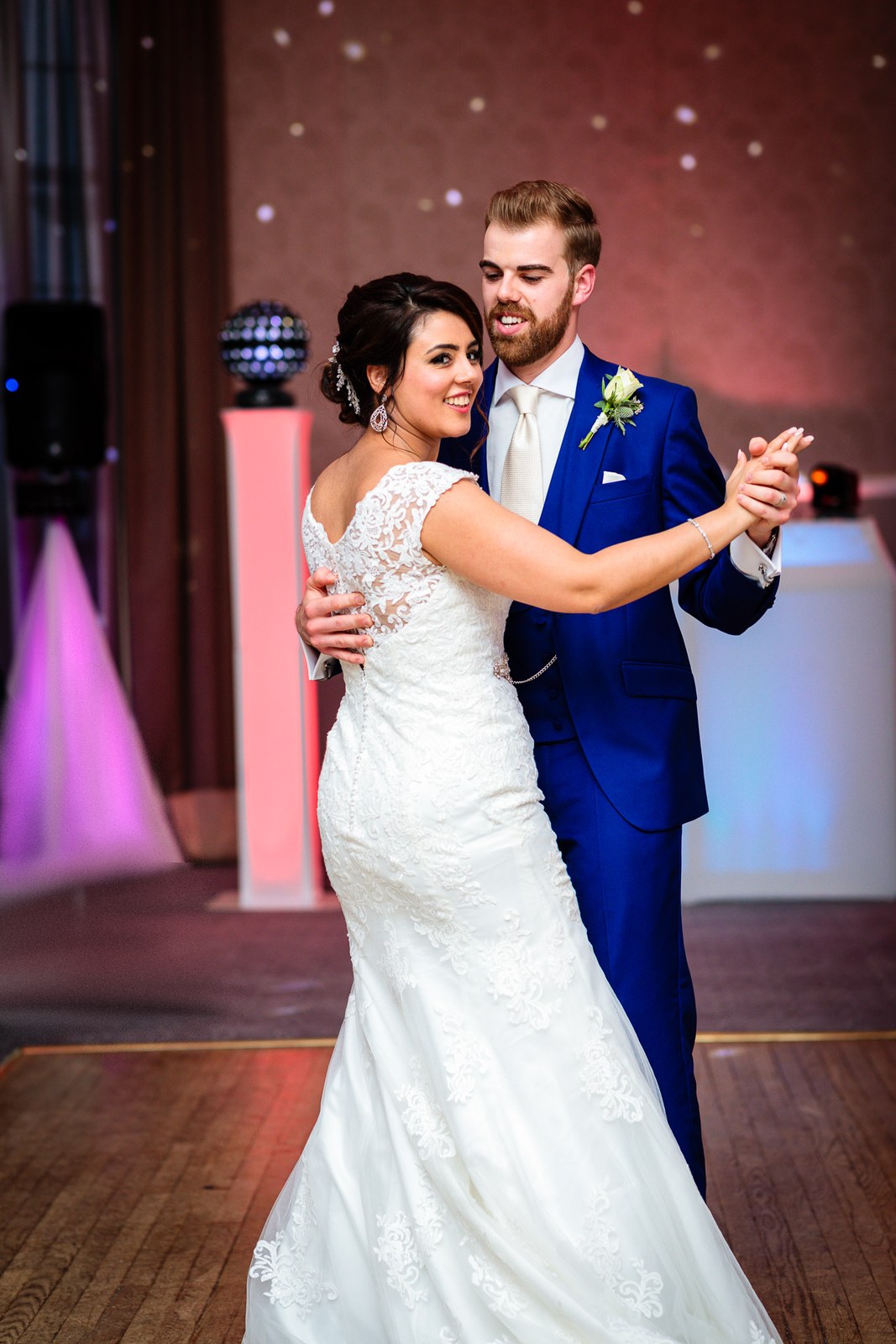The couple's first dance on the floor at Villiers Hotel, a mirror ball beside them