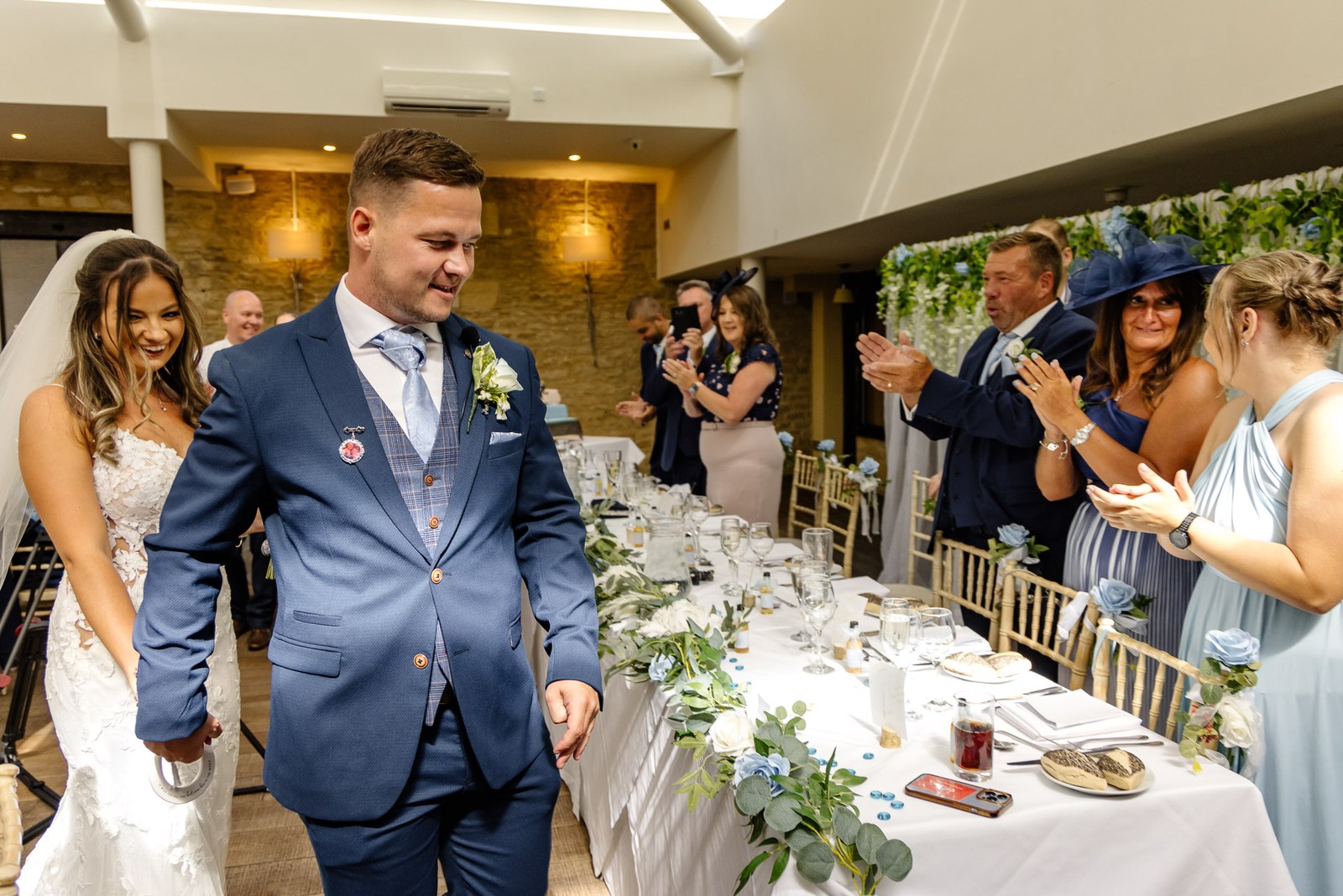 The newlyweds entering the voco Oxford Thames reception to applause