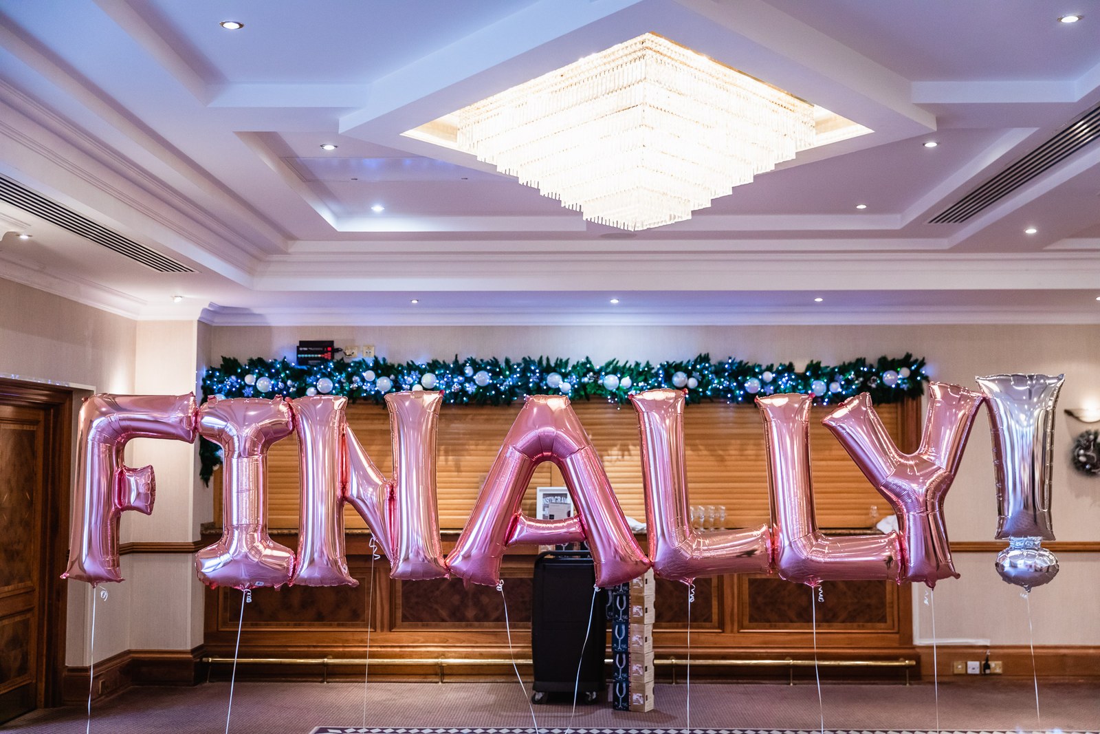 The Windmill Village Hotel reception room with balloon lettering and floral garland
