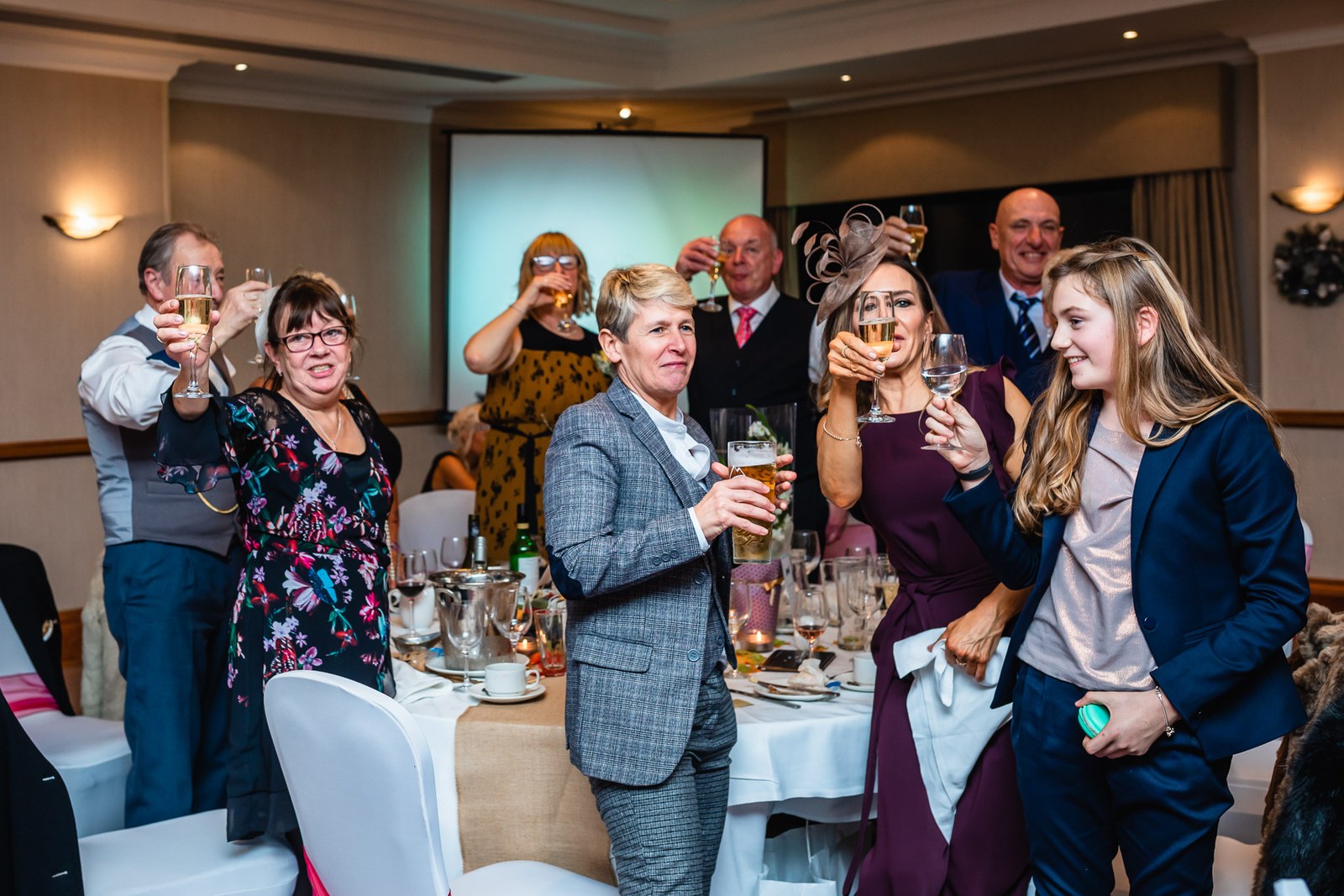 Guests standing to raise their glasses during the speeches