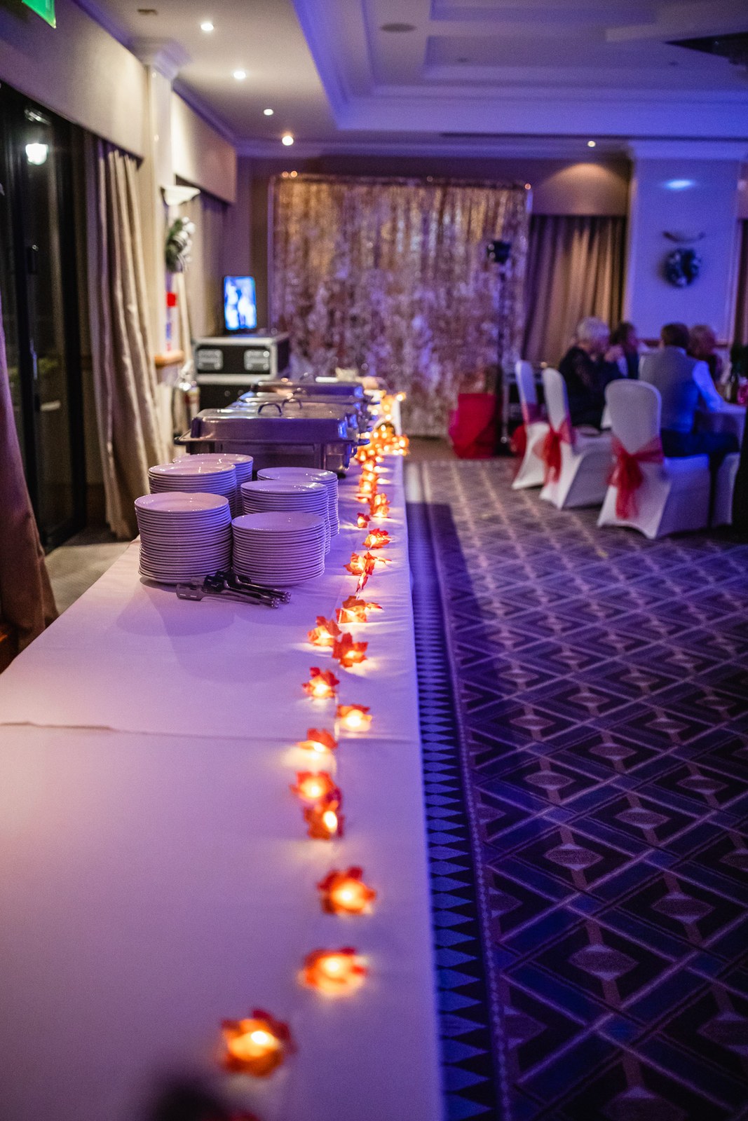The long evening buffet table at Windmill Village Hotel set with candlelight