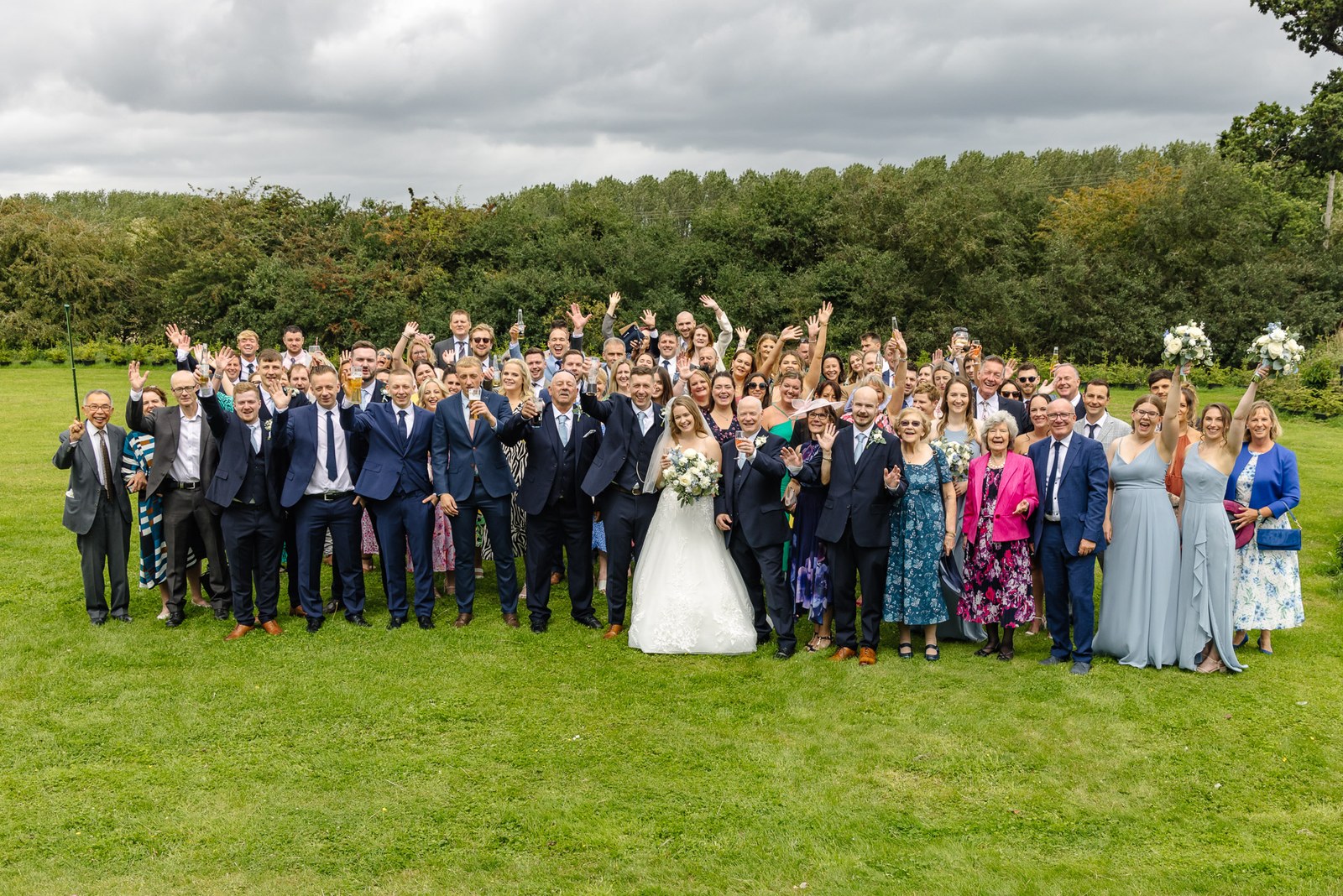 Guests gathered for a group portrait on the Winters Tale Country Barn lawn