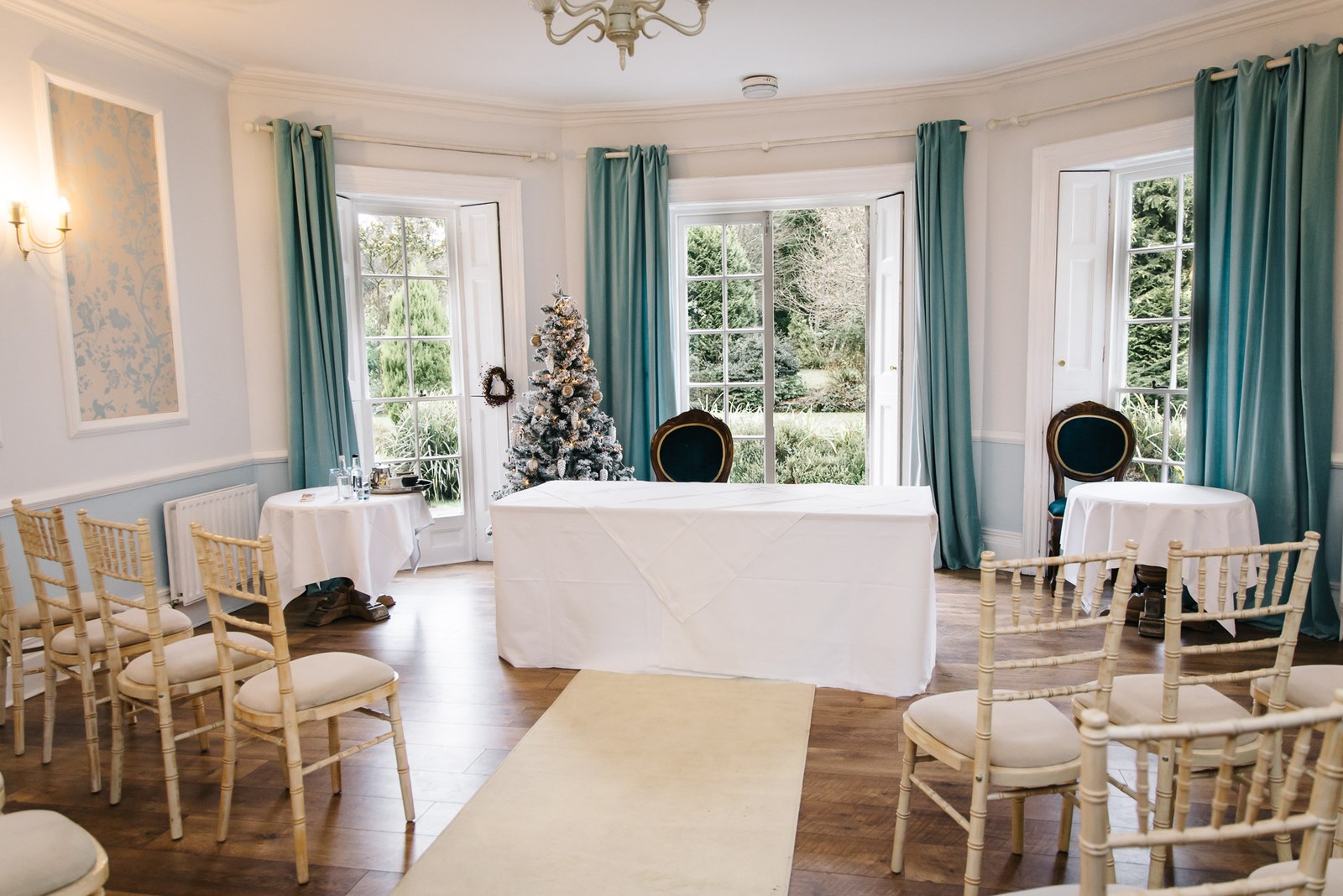 The ceremony room at Woodlands Lodge Hotel set with chairs and a Christmas tree