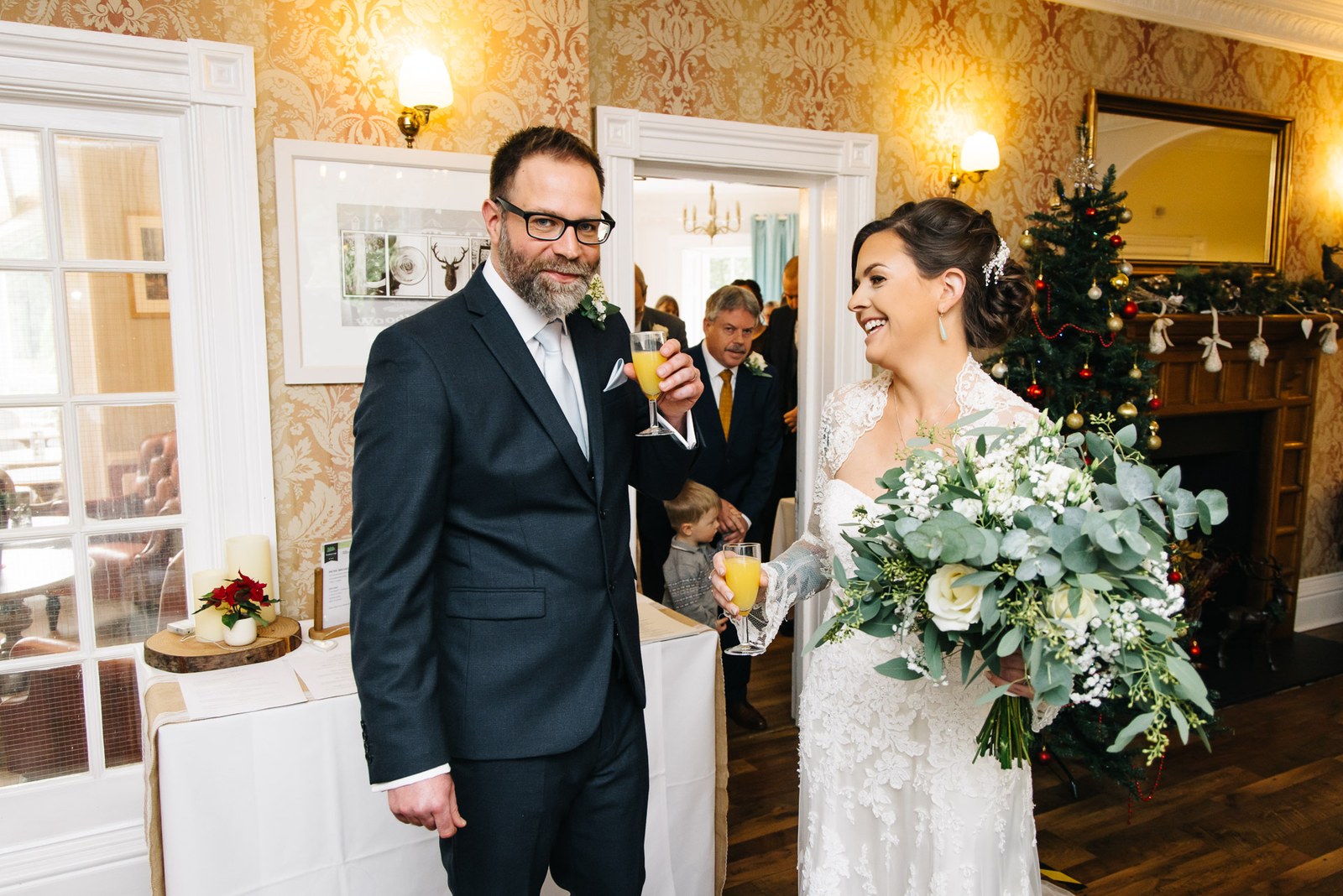 The newlyweds arriving at the Woodlands Lodge Hotel reception past the Christmas tree