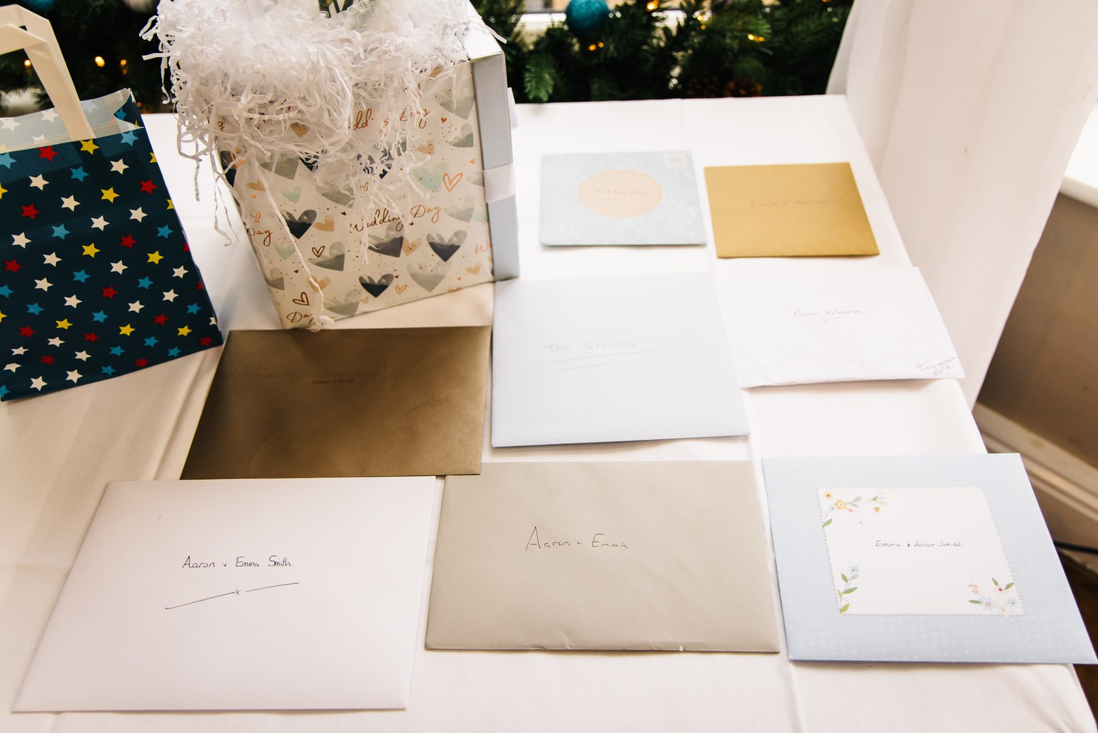 Guest cards and gifts arranged on a table