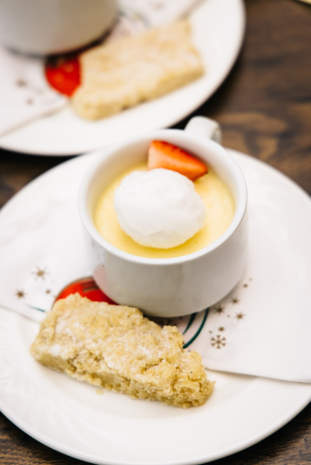 A dessert of lemon posset with ice cream and shortbread
