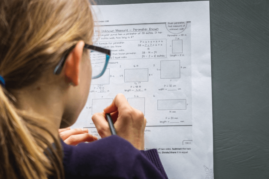 Student solving a Math equation