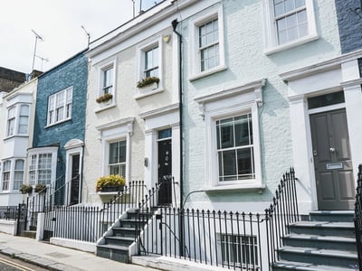 Colorful houses on Hillgate Place and Callscott Street, showcasing charming and unique London architecture.