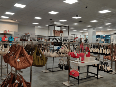 A varied selection of handbags showcased in the Century 21 store in New York, featuring trendy styles.